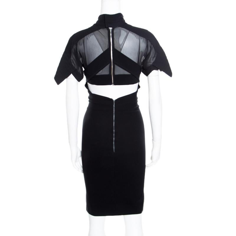 Words are not enough to describe how chic, stylish and amazing is this Preen by Thornton Bregazzi dress! The black creation is made of 100% silk and features a flattering feminine silhouette. It flaunts a sheer panel design on the bodice with a wrap