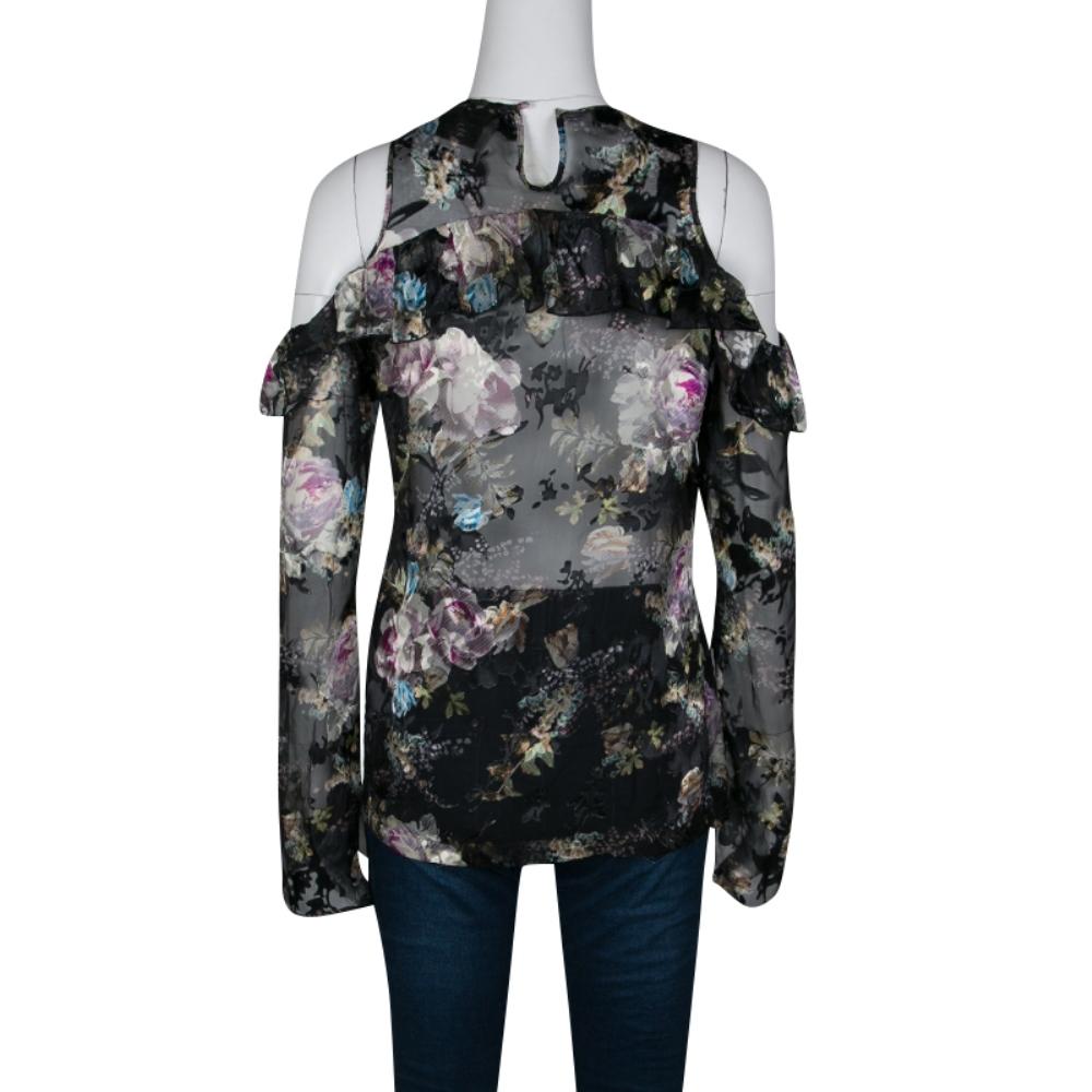 Known for their statement prints and figure-flattering dresses, Preen By Thornton Bregazzi is loved label of celebrities. This Alva top is crafted with a silk blend in black color featuring a beautiful floral print. It is designed with a