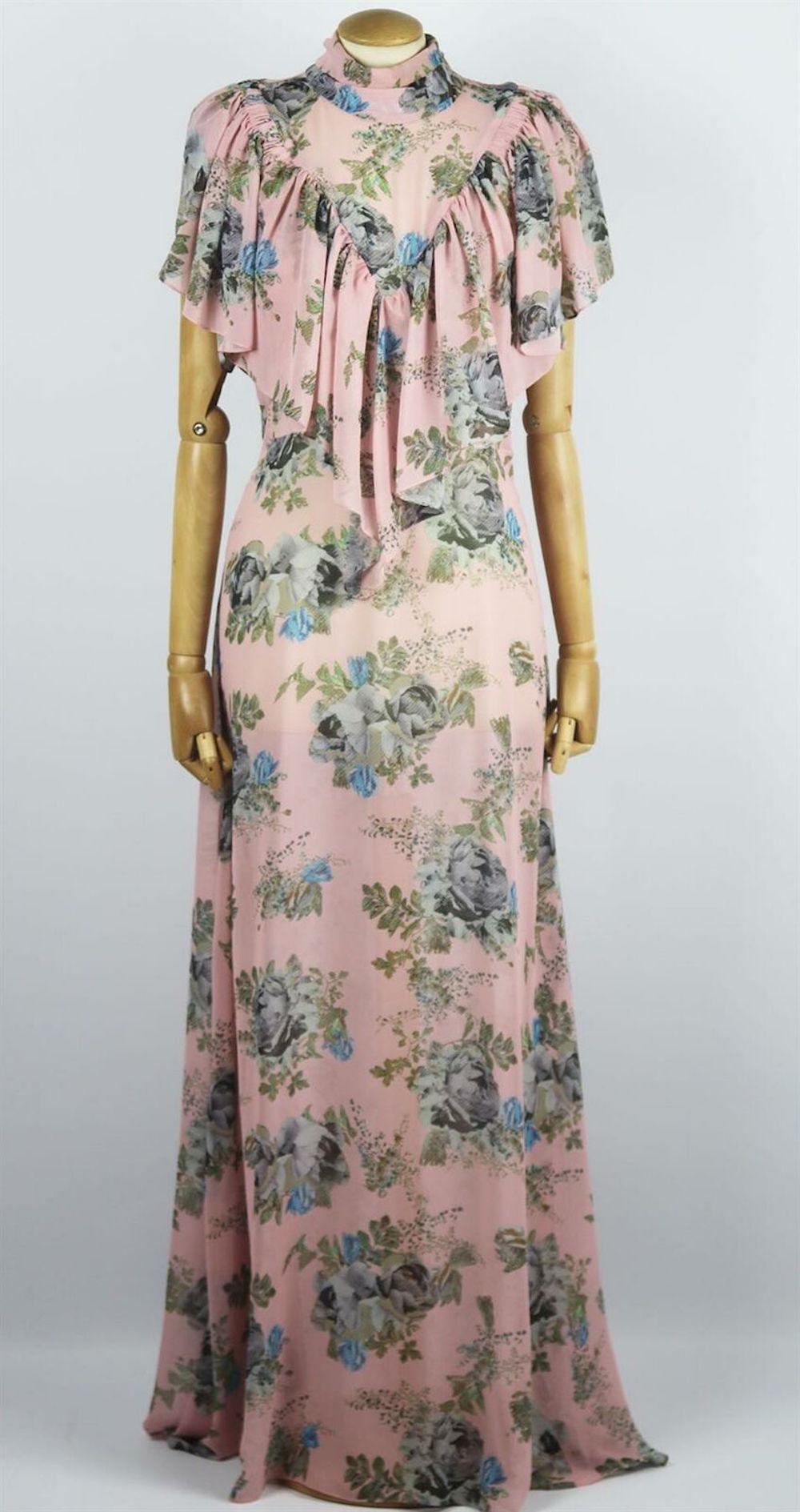 Preen by Thornton Bregazzi's maxi dress is decorated with the same floral-print seen throughout the collection, cut from floaty georgette, it has a figure-skimming silhouette and romantic ruffles along the yoke. 
Multicolored