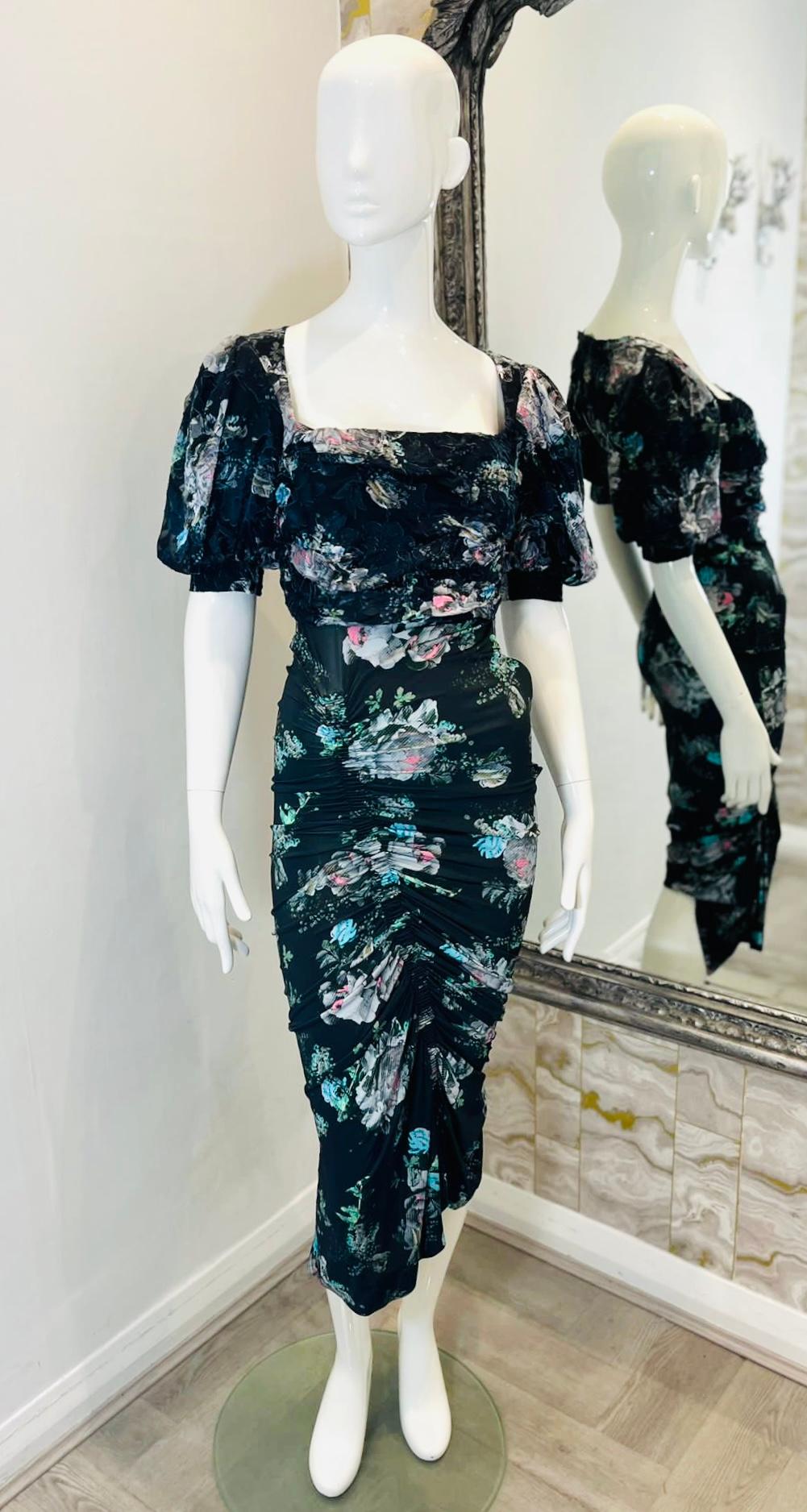 Preen By Thornton Bregazzi Silk Blend Floral Dress

Black midi dress designed with painterly floral blooms print.

Detailed with short balloon sleeves and square neckline.

Featuring asymmetric, ruched bodycon skirt and triangle shaped cut-out to