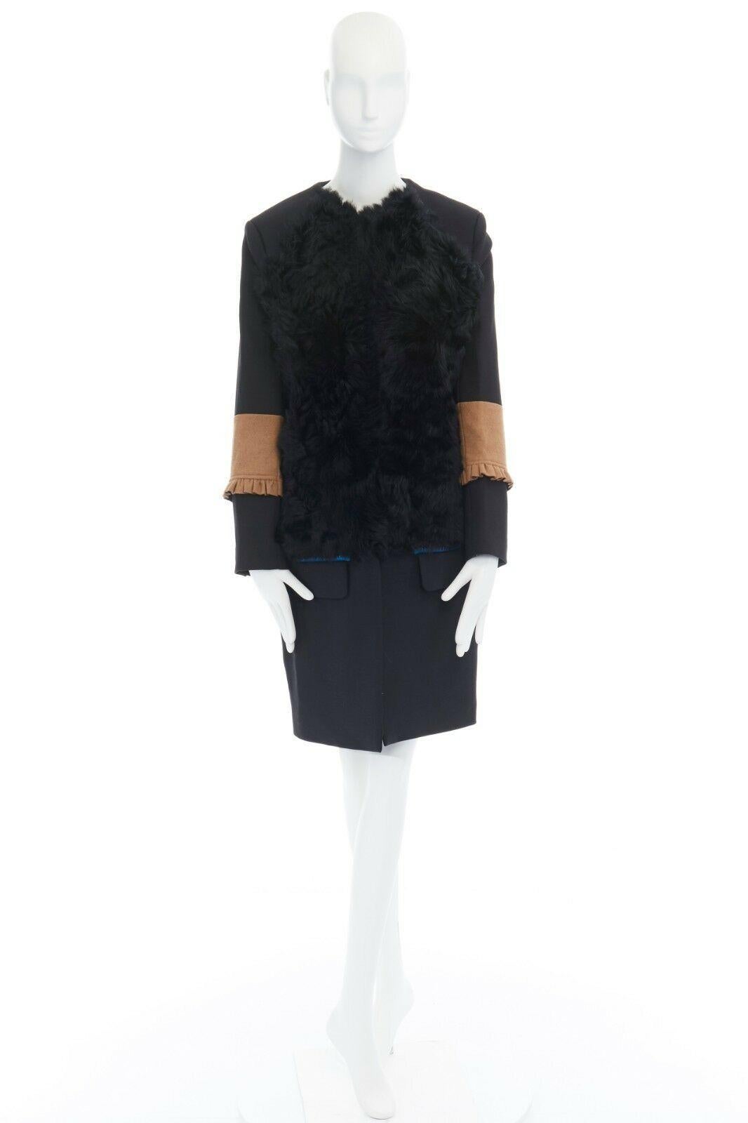 PREEN THORNTON BREGAZZI black fur front ruffle cuff flap pocket wool coat S 
Reference: WEYN/A00290 
Brand: Preen 
Designer: Thornton Bregazzi 
Material: Cotton 
Color: Black 
Pattern: Solid 
Closure: Zip 
Extra Detail: Cotton, wool, polyurethane,