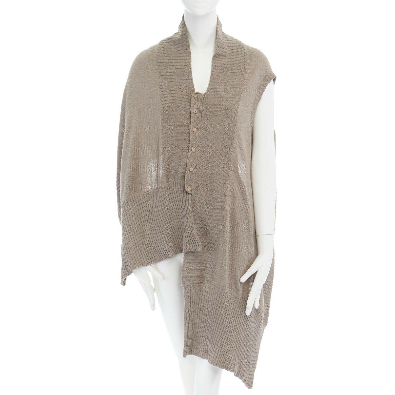 PREEN THORNTON BREGAZZI brown wool asymmetric button button front shawl cardigan 
Reference: TGAS/A02233 
Brand: Preen 
Designer: Thornton Bregazzi 
Material: Unknown 
Color: Brown 
Pattern: Solid 
Closure: Button 
Extra Detail: eels like taupe