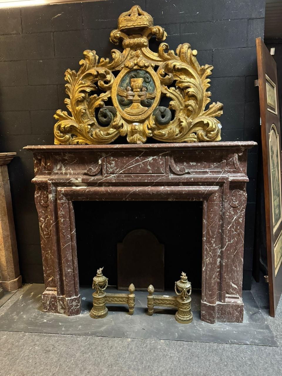 Antique and Precious mantel fireplace, constructed of French Red marble with beautiful light white veining, The frame features carved geometric moldings with space for central coat of arms, very rich and with beautiful scenic presence, it is