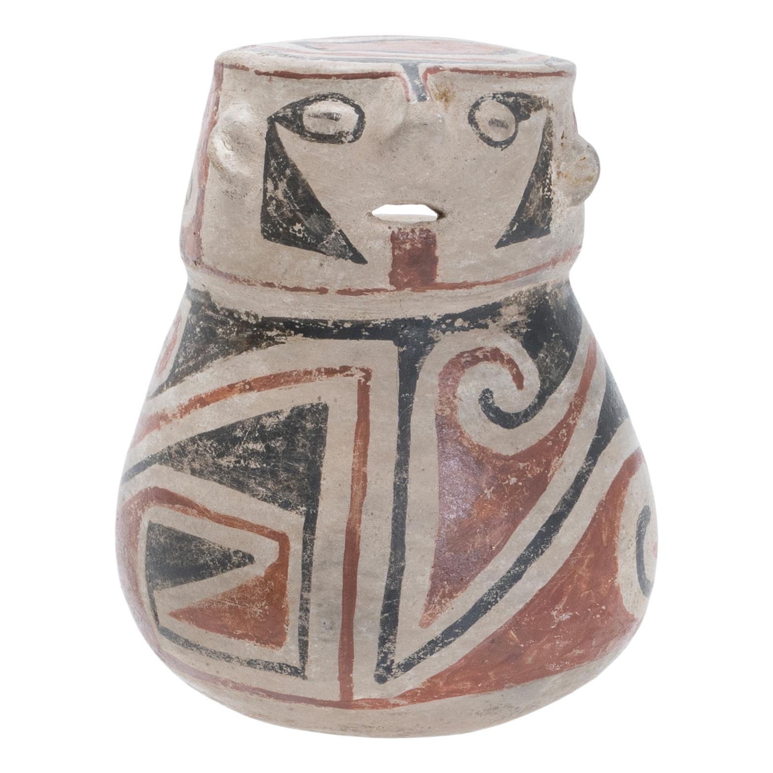 Pre-Columbian, Northern Mexico, Casas Grandes, ca. 1100 to 1200 CE. A delightful coil-made and hand-painted pottery vessel of figural form, all enveloped in beige slip beneath red and black decoration. Sitting upon a round yet stable base, the jar