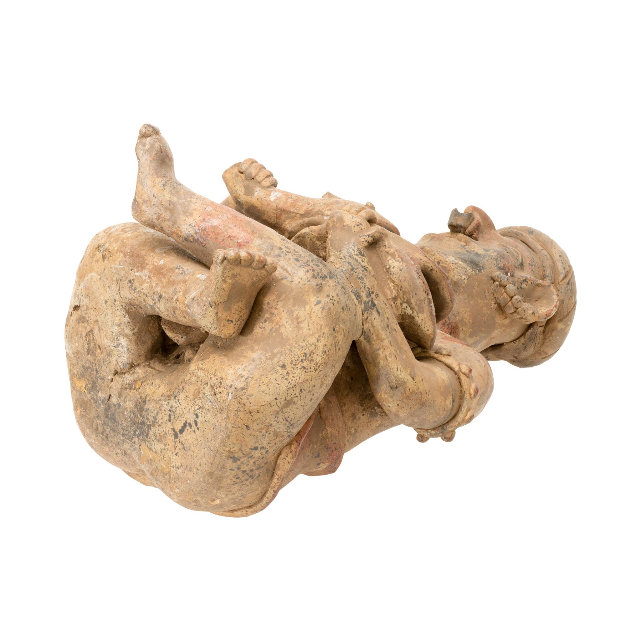 Prehistoric majestic seated drummer figurine from Nayarit, West Mexico. Sporting a nose ring, complex ear ornaments, armlets and an open mouth that would seem to indicate a 'singing' drummer, this seated polychrome figure (CLP33) is attributed to