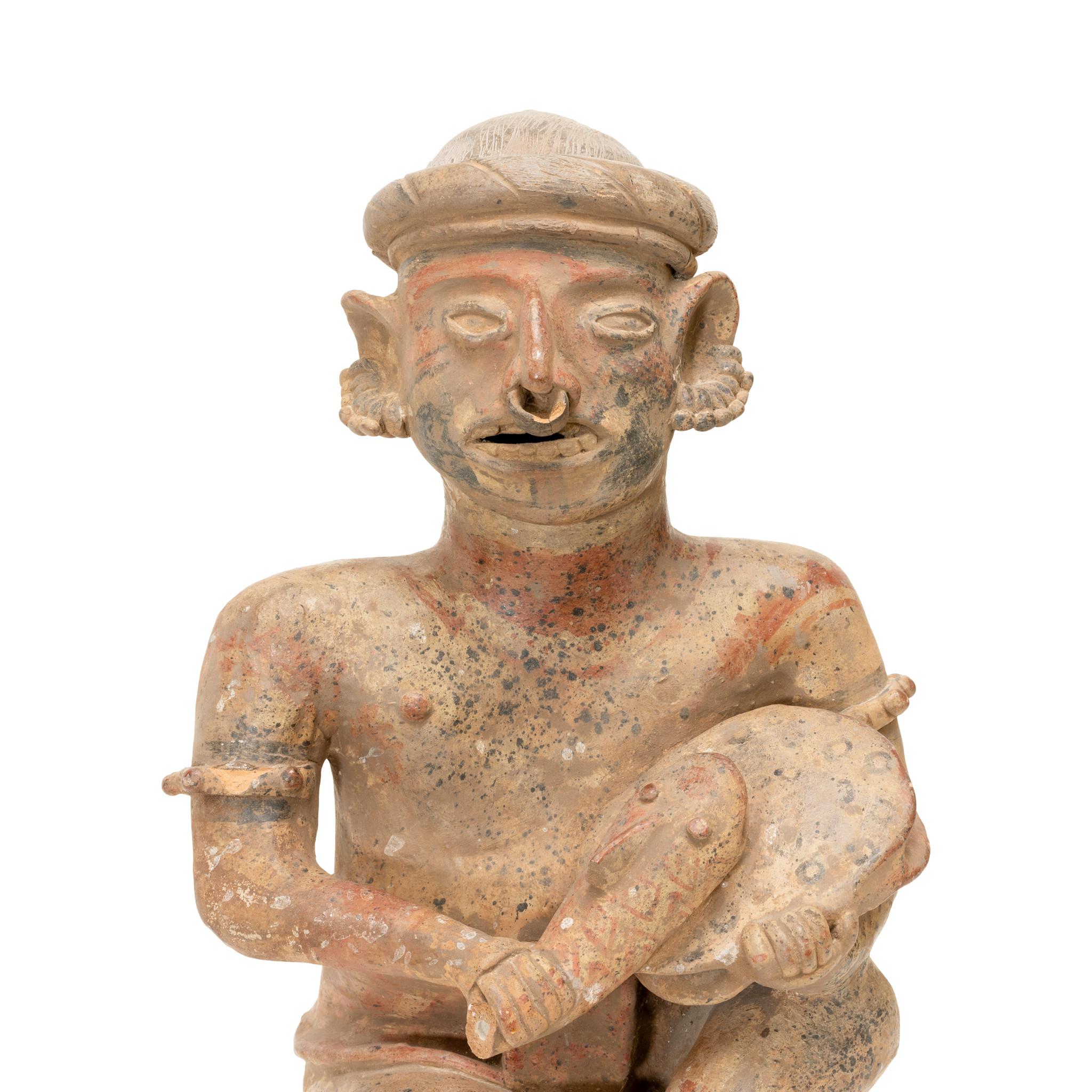 Prehistoric Majested Seated Drummer Figurine In Good Condition For Sale In Coeur d'Alene, ID