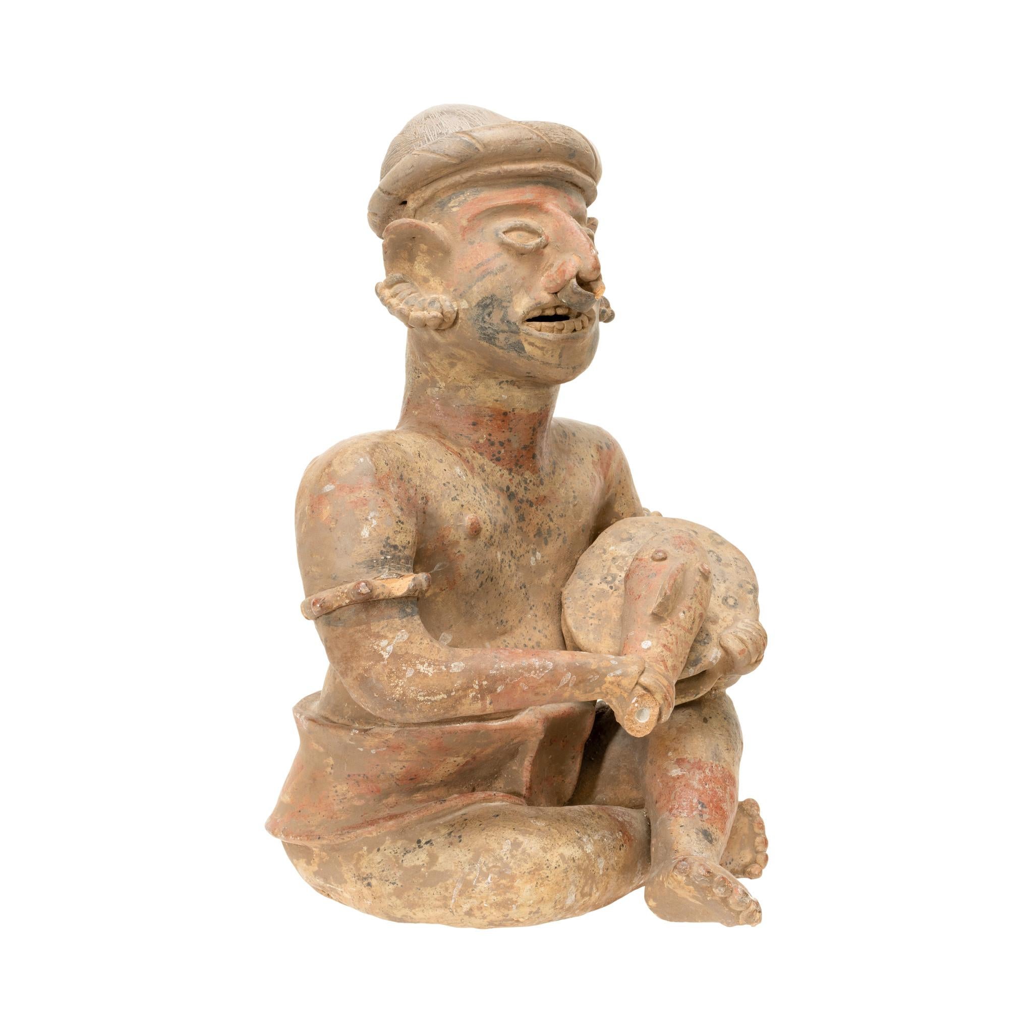 Prehistoric Majested Seated Drummer Figurine For Sale 1