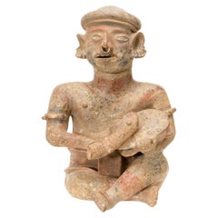 Prehistoric Majested Seated Drummer Figurine