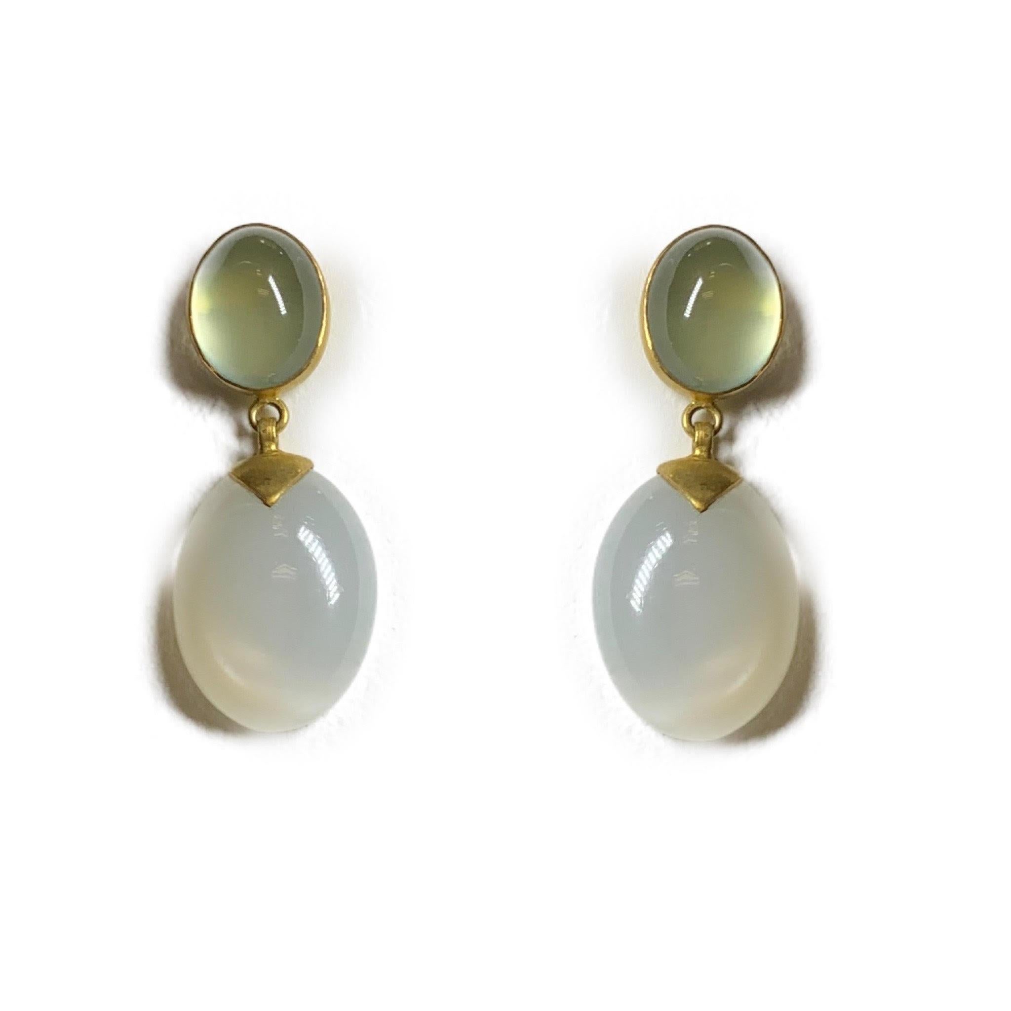 These Prehnite and White Moonstone Dangle earrings are two stones that go together perfectly and make a beautiful pair of earrings. Set in 18 Karat Yellow Gold with a soft satin finish. 
Prehnite is considered to be the stone of unconditional love