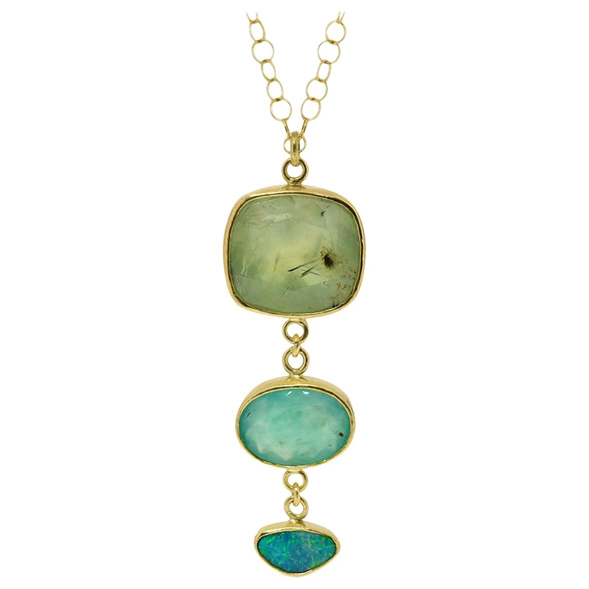 This tier necklace is comprised of a 12.9 carat cushion cut Prehnite, a 3.77 carat Aquaprase (which is aquamarine + chrysoprase) and a sweet little .965 boulder Opal doublet -- which has  green/blue 
