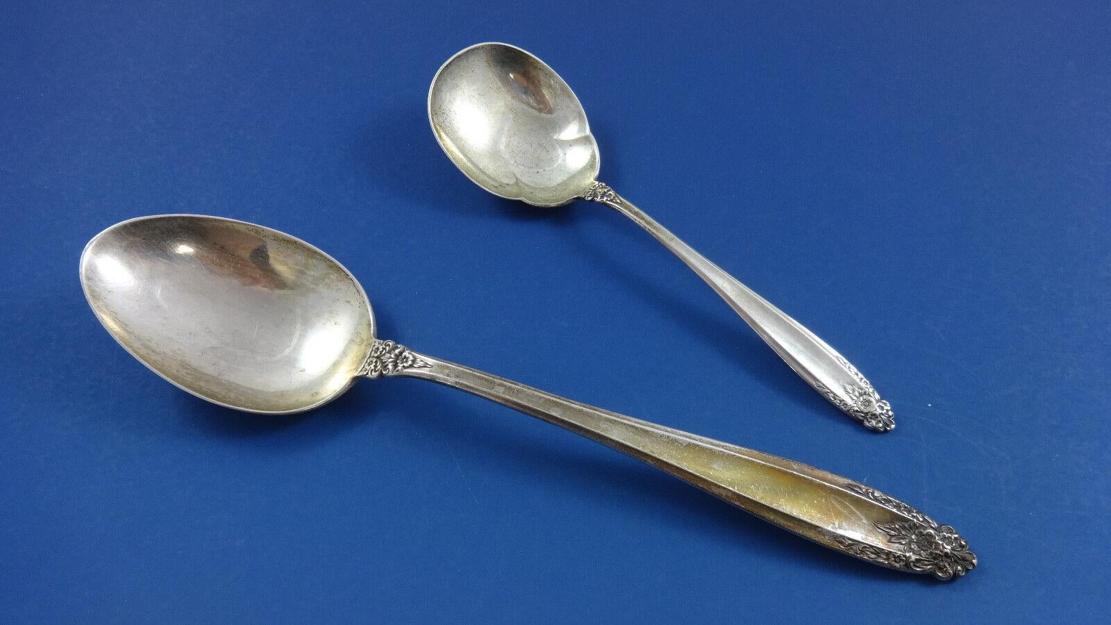 Slender and graceful, the smooth clean lines of this refined pattern are distinguished with deeply carved floral ornaments at the tip and neck. Raised borders along the fluted stem enhance the sophisticated simplicity and understated elegance of the