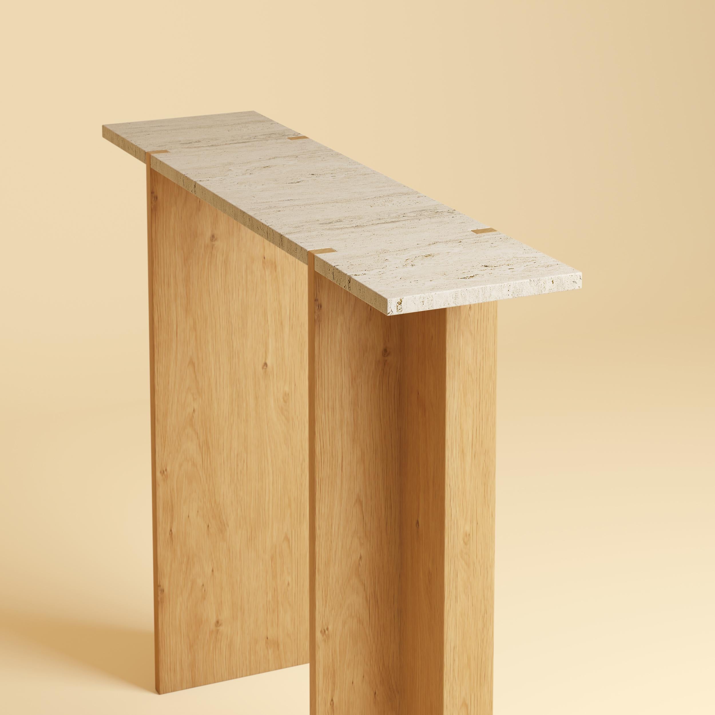 The Maha Console Table by Lebanto is a stunning blend of natural materials and expert craftsmanship, designed to bring timeless elegance to your home. Featuring a luxurious marble or travertine tabletop and solid oak legs, this console table is a