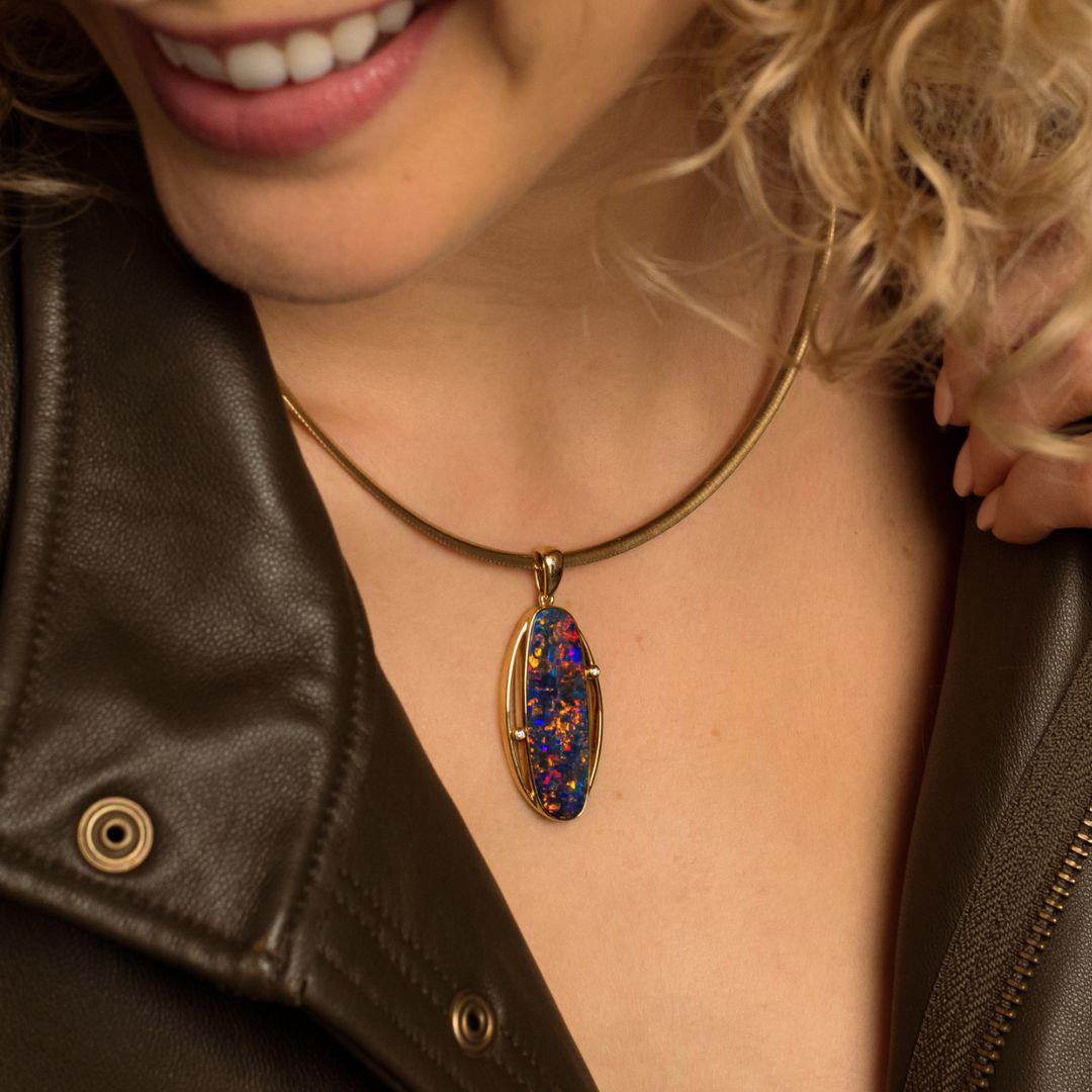 Incredibly unique and elegant, the ‘Alice’ opal pendant features a one-of-a-kind Australian black opal doublet (10.93ct). Cradled in classic 18k yellow gold and adorned by two dazzling diamonds, the precious gemstone of this piece is awe-inspiring