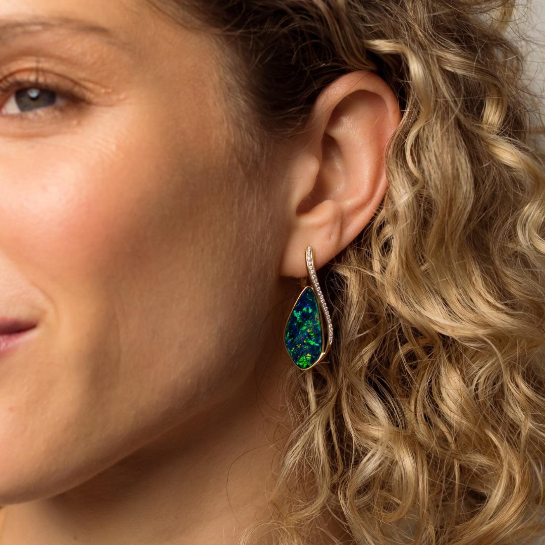 Mesmerising creation – the “Enchanted” Australian opal doublet (12.22ct) earrings from Coober Pedy, Australia showcases a captivating blue-green play of colour. They are wearable works of art, designed to enchant and captivate all who behold them.