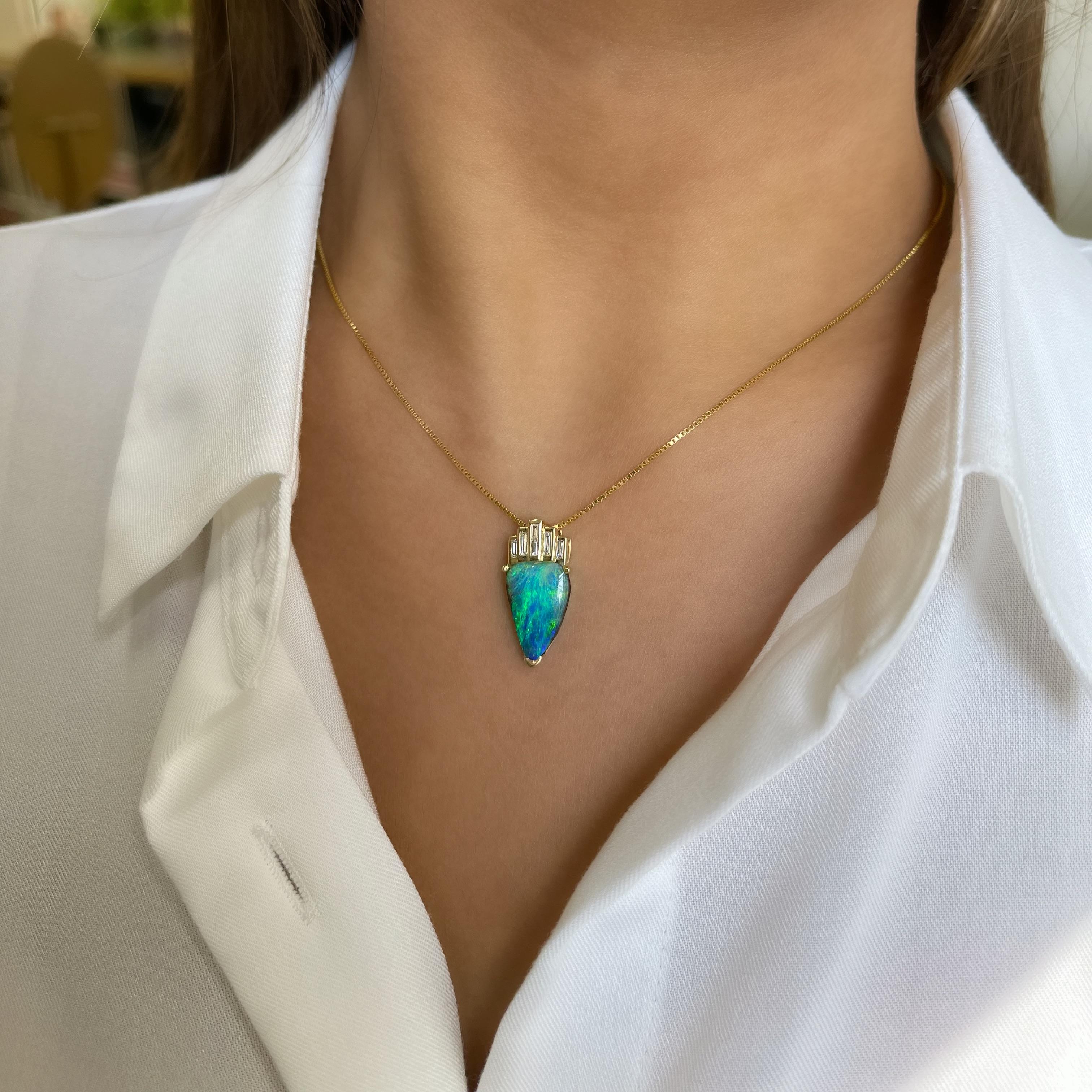 Beyond beautiful, ‘The Crown’ opal pendant features a radiant boulder opal (4.18ct) sourced from Winton opal fields in NSW, Australia. The piece enabling the remarkable green-blue colour-play of the precious opal gemstone to shine. The smooth 18K