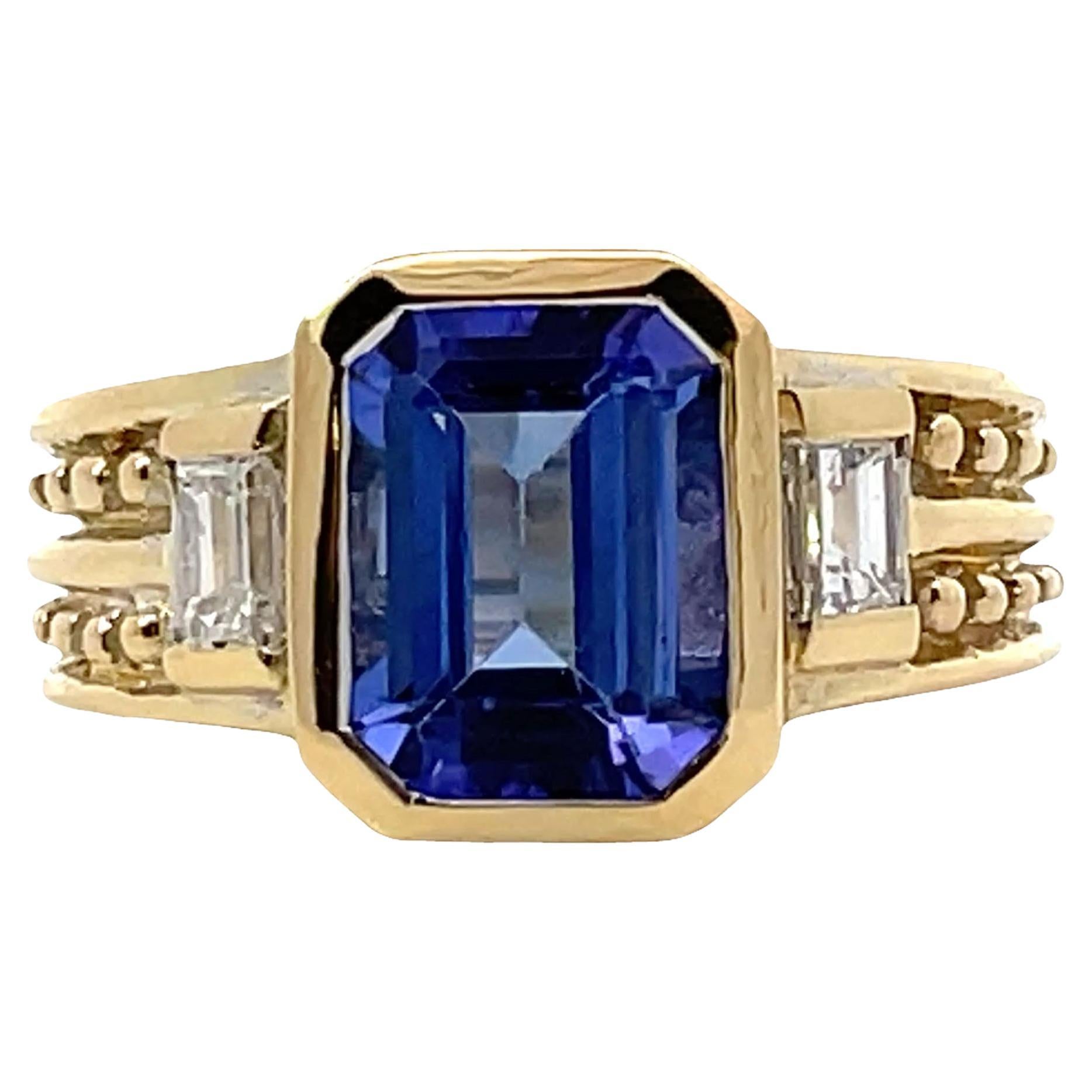 Bague d
occasion en or jaune 18 carats avec tanzanite et 0,50 carats de diamants