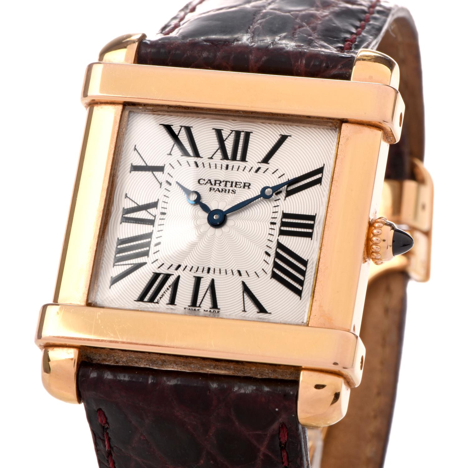 Preowned Pristine condition Men's or ladies Cartier Tank Watch crafted in 18K yellow gold. Circa 2005 and after.

Dial is white ribbed with black Roman numberal markers  Scratch resistant Sapphire crystal on front and back of see through