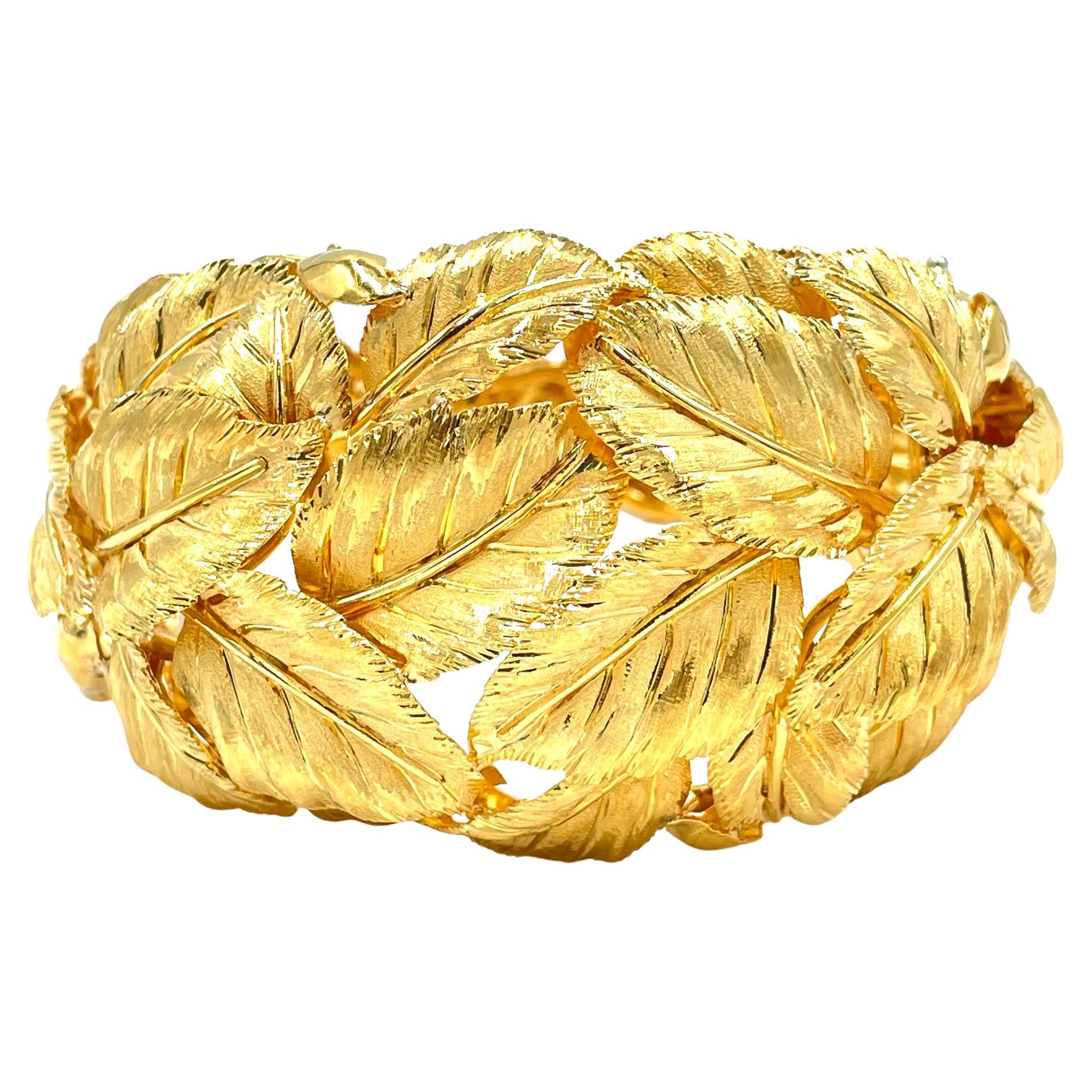 One of a kind, vintage handmade Italian bangle bracelet featuring hand crafted leaves.  The leaves are beautifully hand crafted with the utmost detail. The bracelet is solid and measures approximately 44mm at its widest and tapers down to