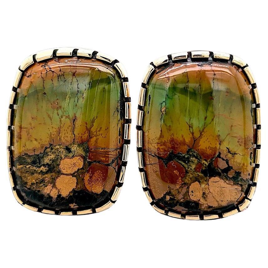 Discover our handcrafted earrings by silversmith Rob Sherman. These earrings feature cowboy and bohochic aesthetics. Perfect for those who appreciate a blend of traditional and modern styles! Each pair is uniquely mismatched, featuring green