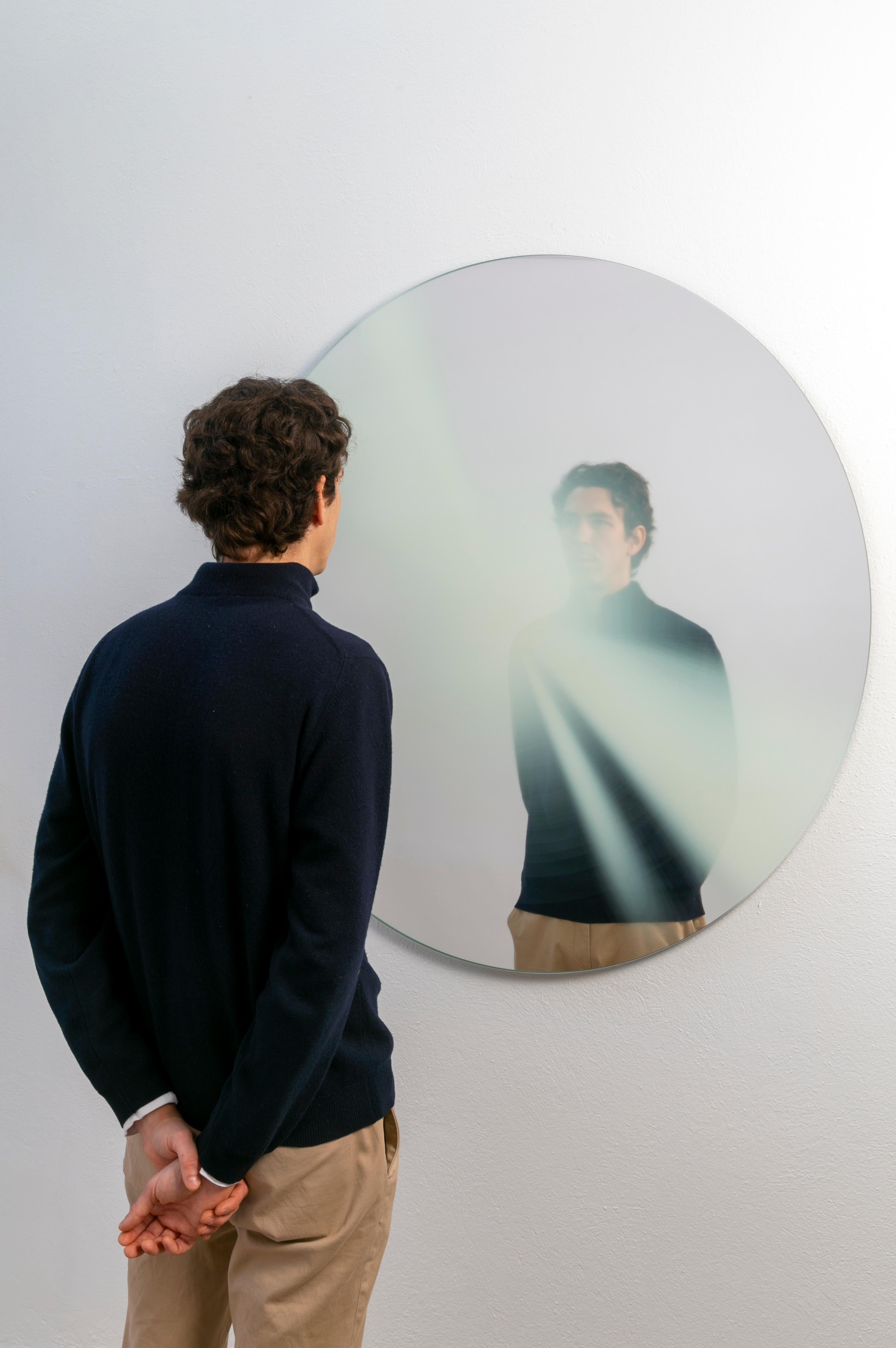 Presence part of a limited series of glass mirrors resulting from the exploration of the presence of light through a multi-layered perspective. 

The mirror aims to enhance the beauty of natural sunlight through its subtle manipulation and