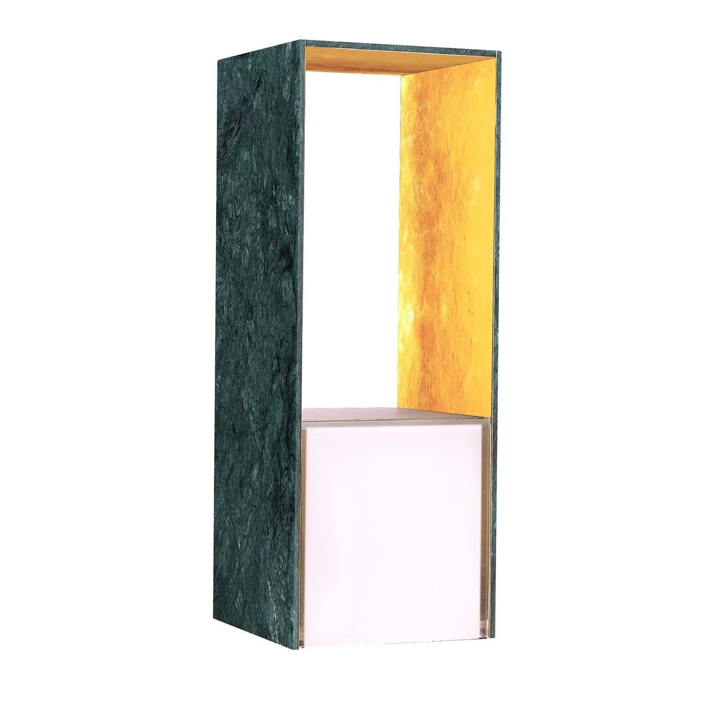 The presence table lamp in Verde Guatemala and gold is a fabulous LED lamp with indirect light and dimmable touch switch made of hand-worked marble coupled with metal using the Petramet technique and finished with gold or silver leaf. The spread of