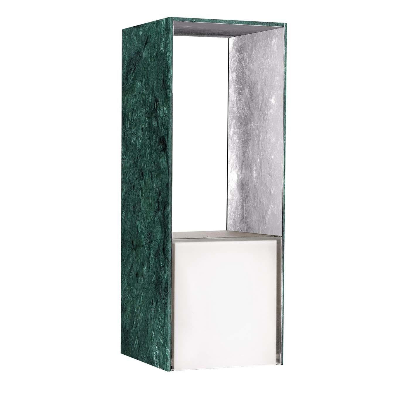 A deluxe LED lamp with indirect light and dimmable touch switch, the presence table lamp in Verde Guatemala and silver is made of hand-worked marble coupled with metal using the Petramet technique and finished with gold or silver leaf. The central