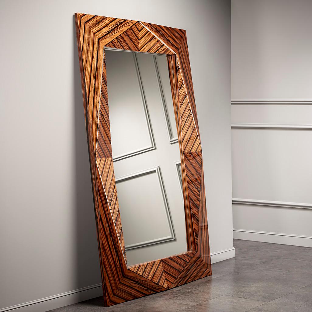 This grandiose mirror will frame your present. The wooden frame turns this mirror into a furniture that will always add an elegant look to the surrounding reflection.
 