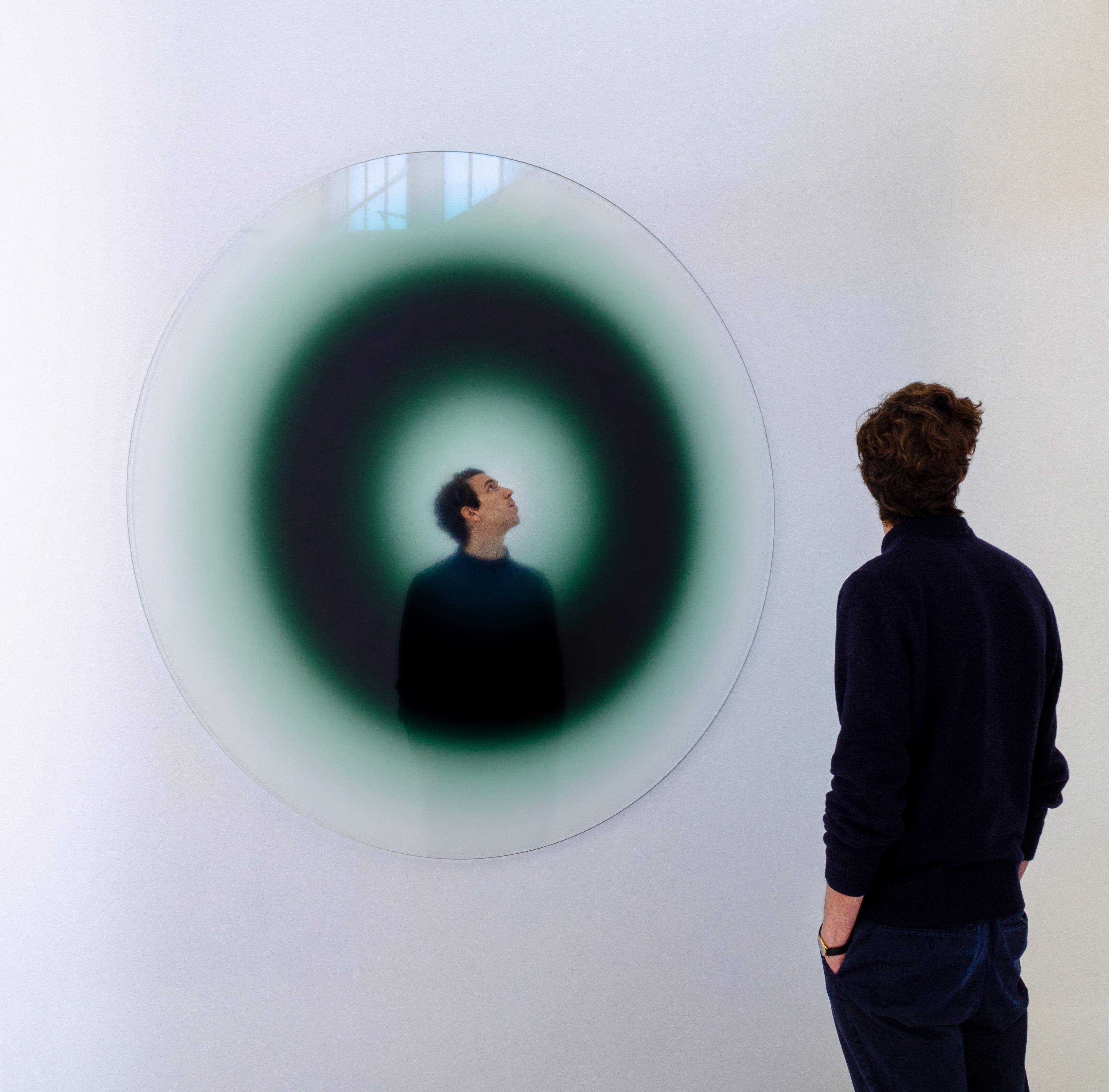 The Present wall mirror by Celo.1
Dimensions: D160x H2 cm

The Present
This object is the mirrored opposite of ‘Inevitable Future’ and similarly is also composed by three areas: an outer ring of transparent glass, an inner dark-shaded ring and a