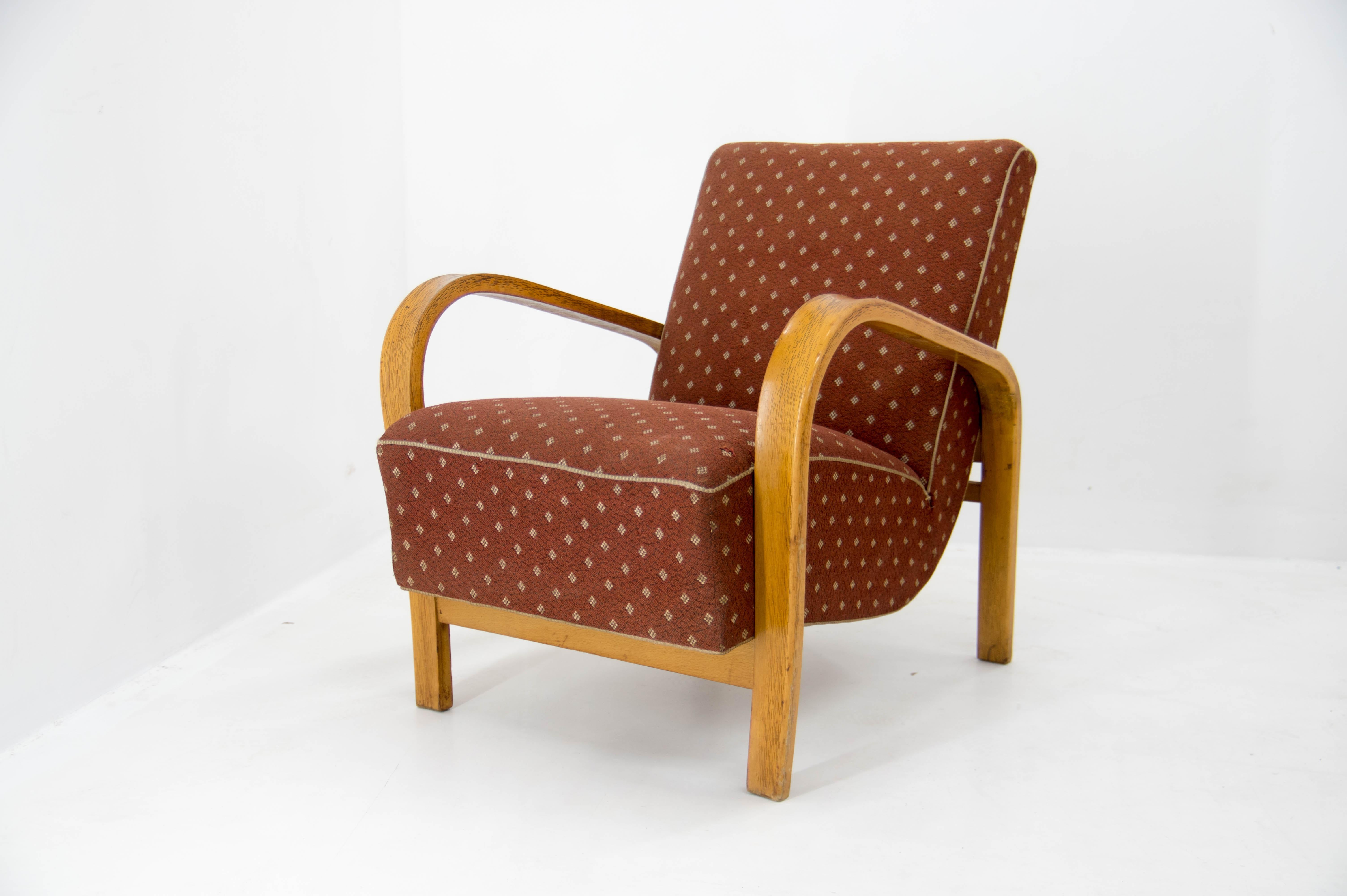 Very well preserved armchair designed by Kozelka a Kropacek for Interier Praha.
Wood in perfect condition, upholstery with one minor defect see photo. Spring core in perfect condition, very sturdy and comfortable.

