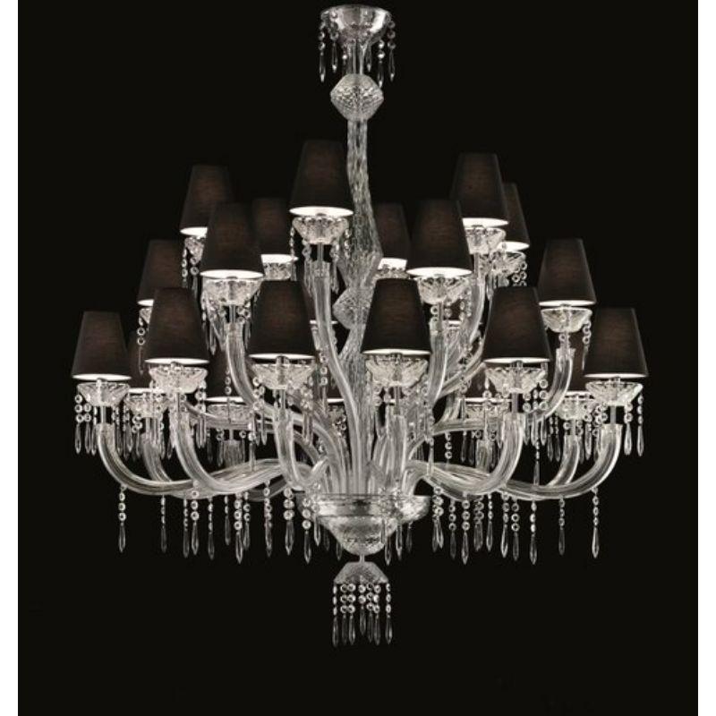 An iconic chandelier with arms par excellence that proudly displays its painstaking workmanship and elegance. Chiseled prisms, sparkling pendants and decorated cups make this a truly unique decor feature, in which Venetian crystal reveals its