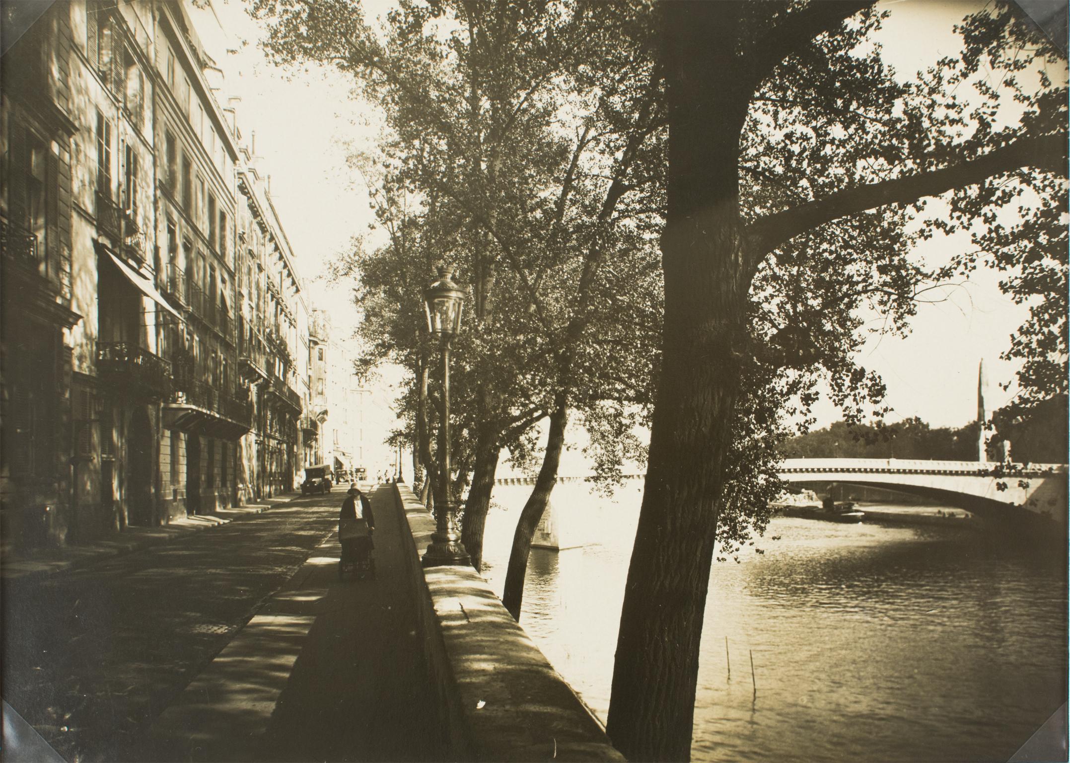 A unique original silver gelatin black and white photograph by Press Agency A. Harlingue, Paris. Paris, a view of The Ile Saint Louis, circa 1930.
The view is taken from the Quai d'Orleans in the Ile Saint Louis, and the background on the right side