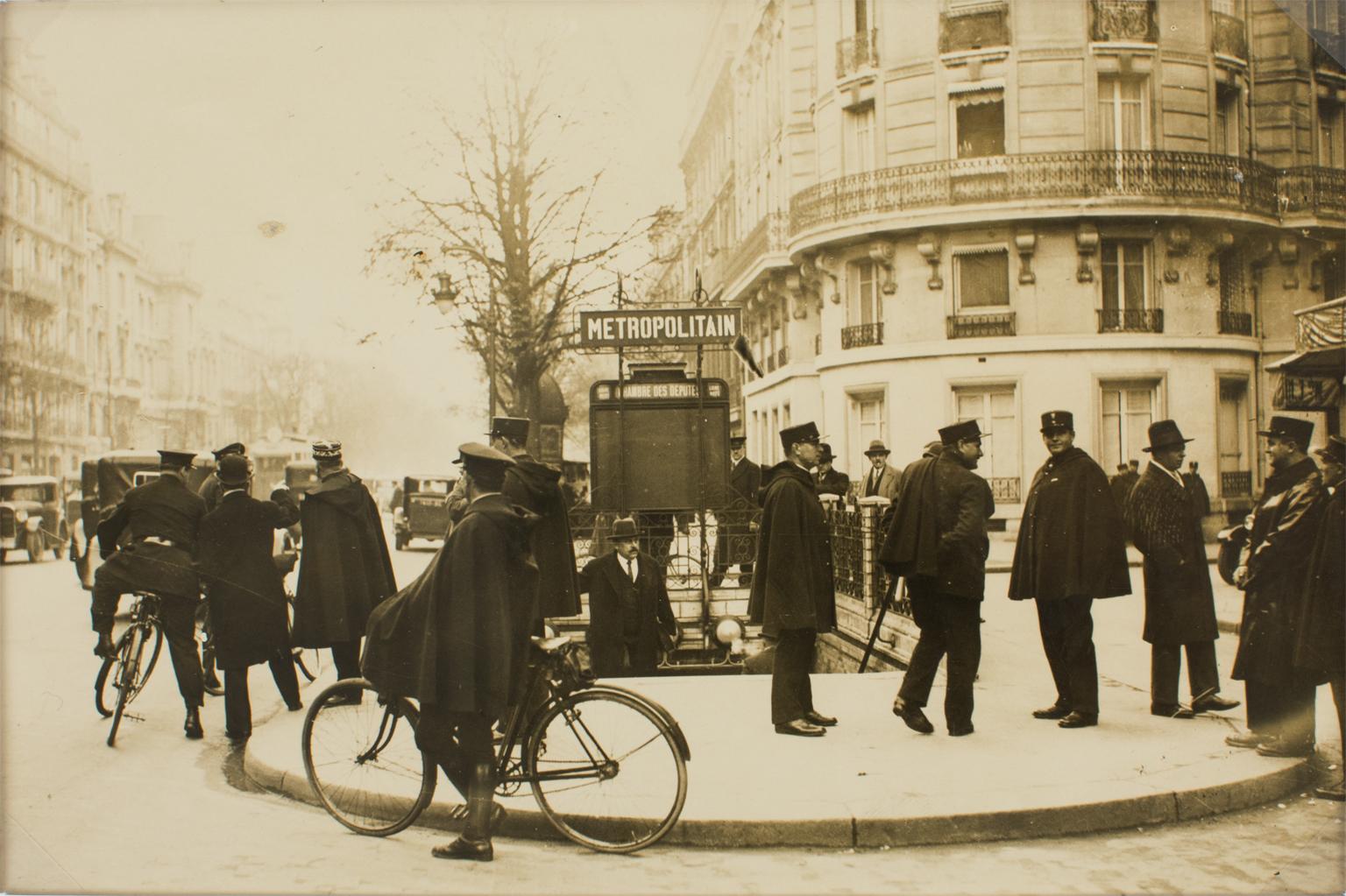 A unique original silver gelatin black and white photograph by Press Agency Keystone View Co. Policemen in Paris, circa 1930.
French police officers in Paris in front of a subway station waiting for the start of a communist demonstration. In the