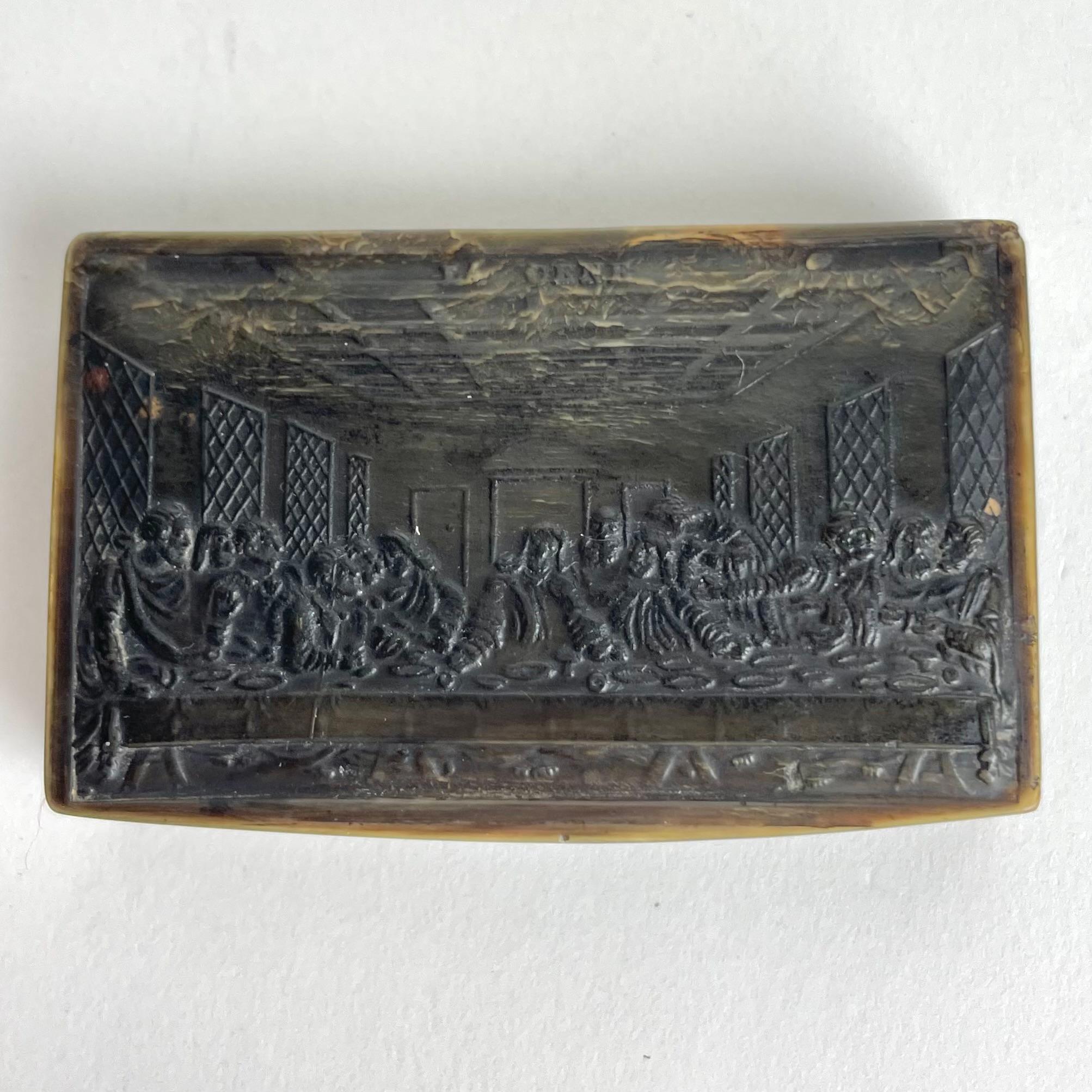 Lovely Pressed Bovine Cow Horn Snuff Box featuring a Bas-Relief carving of the Last Supper (La Cene) by Leonardo da Vinci. Early 19th Century France.

A charming snuff box in pressed bovine horn. The lid is functional with working hinge and features