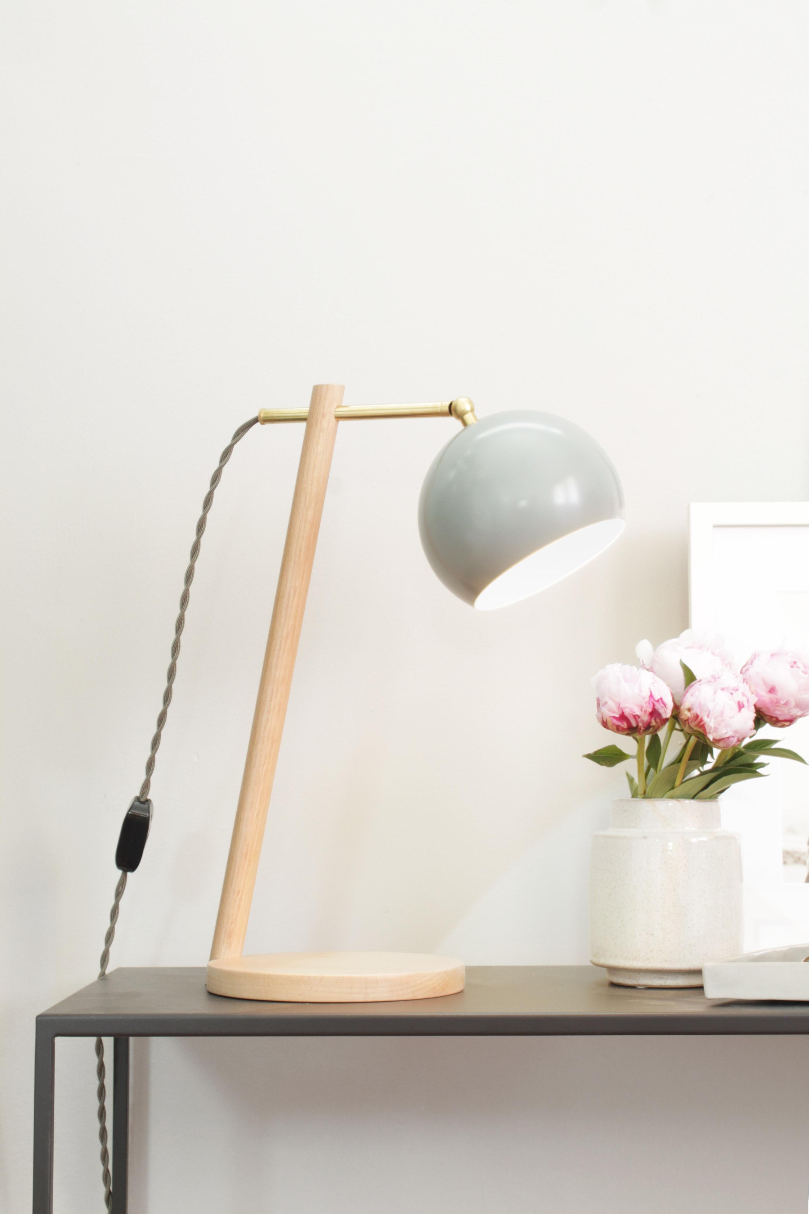 The all new Preston task lamp works just as hard as you do. The sliding brass arm along with the pivoting powder coated steel lamp shade allow you to adjust the light source to you desired location. The solid wood base is handcrafted in a variety of