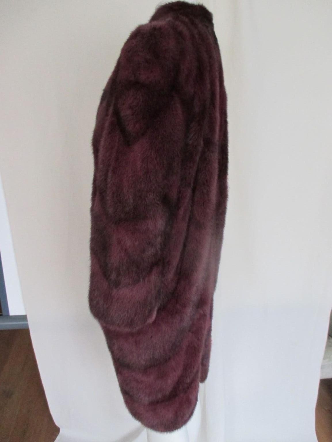 We offer more exclusive fur items, view our frontstore

This vintage flared 3/4 length dyed burgundy mink coat is made of soft quality fur with 4 closing hooks, 2 pockets, inside pocket and a split at the back.
Pre-loved condition with some wear of