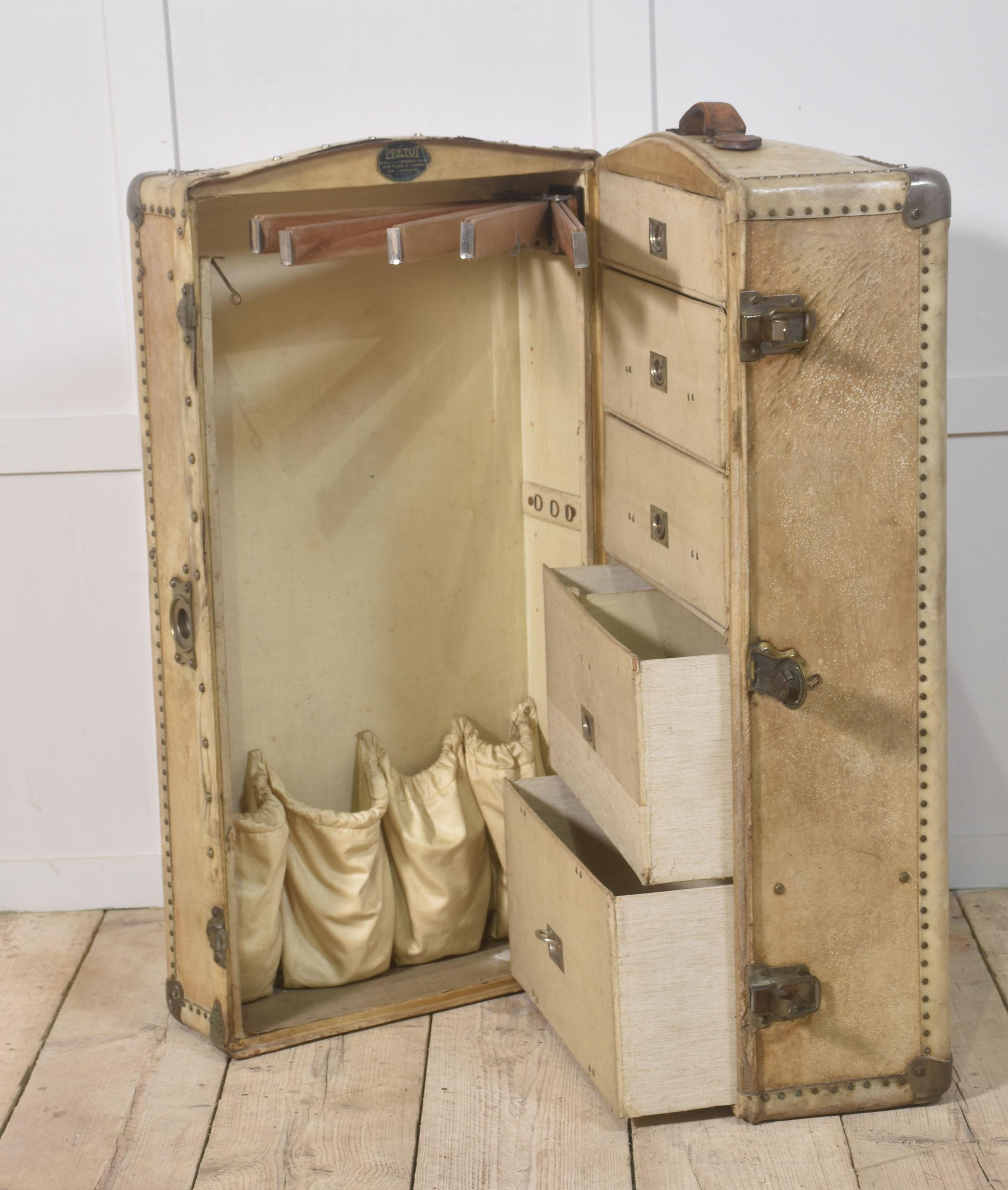 Early 20th-century steamer travelling trunk, in leather finish with metal fixtures, the interior fitted with drawers and hangers.
Dimensions
Height 16 Inches
Width 41 Inches
Depth 21 Inches