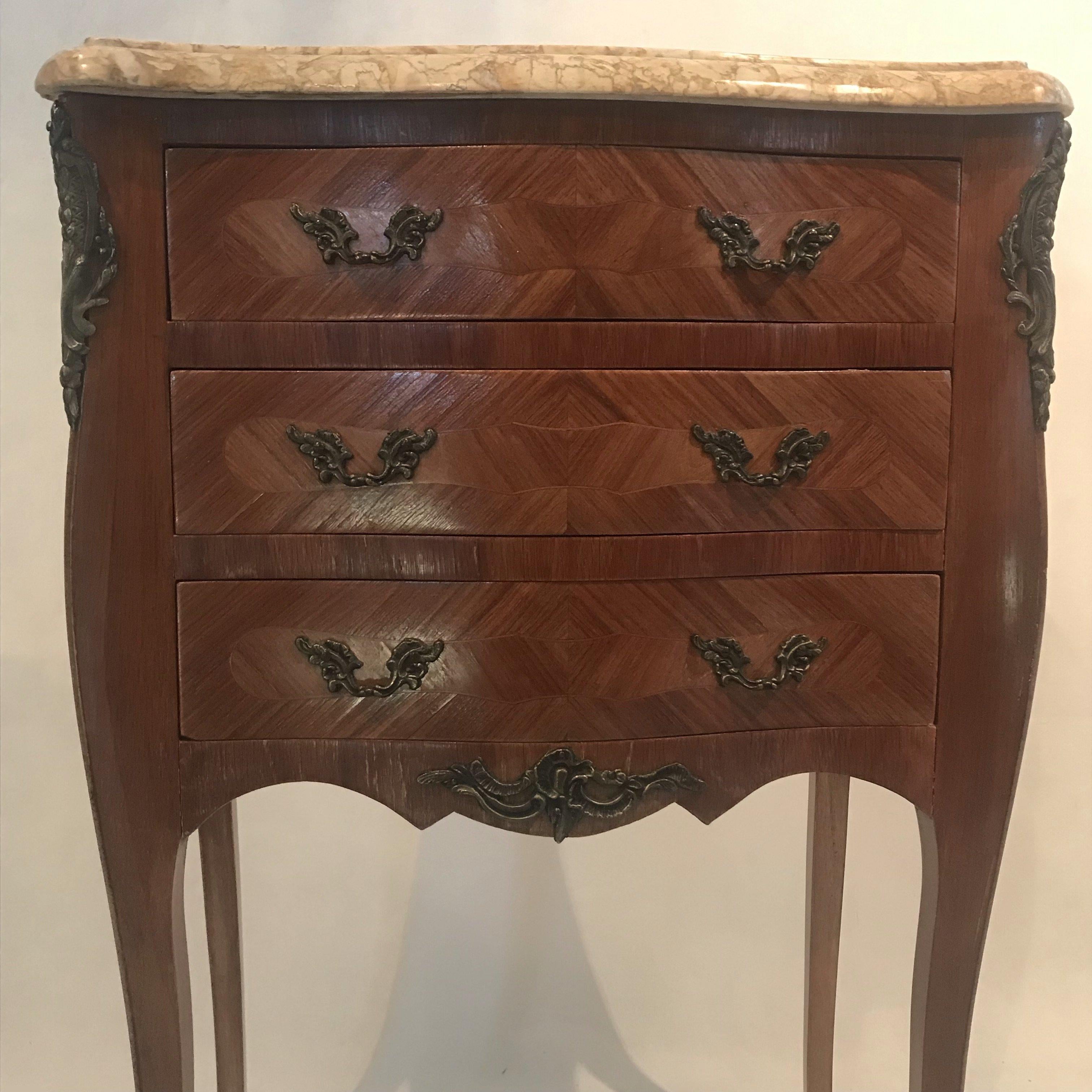Beautiful slightly larger French inlaid marble-top nightstands with three spacious drawers. Bought in Lyon, France. Gorgeous marble top with beige and brown veining.
#4866.