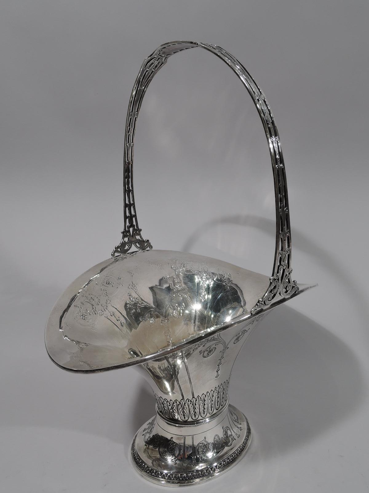 Pretty Art Nouveau sterling silver bridal basket. Made by Gorham in Providence in 1917. Oval body with wide and flared mouth, and spread foot. Engraved, chased, and applied ornament, including scrolls, paterae, flowers, and leaf-and-dart. Fixed open