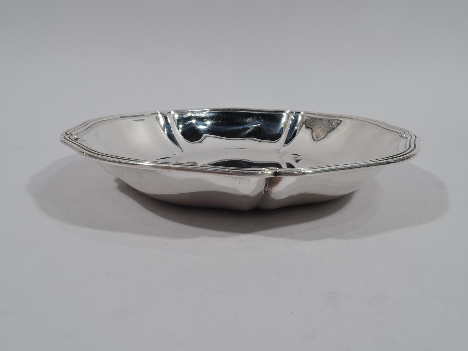 Craftsman sterling silver bowl. Made by Arthur Stone (d. 1937) in Gardner, Mass. Round with slash lobing and gently wavy and reeded rim. Soft and pretty. Fully marked including small-case letter C, which represents a silversmith active from