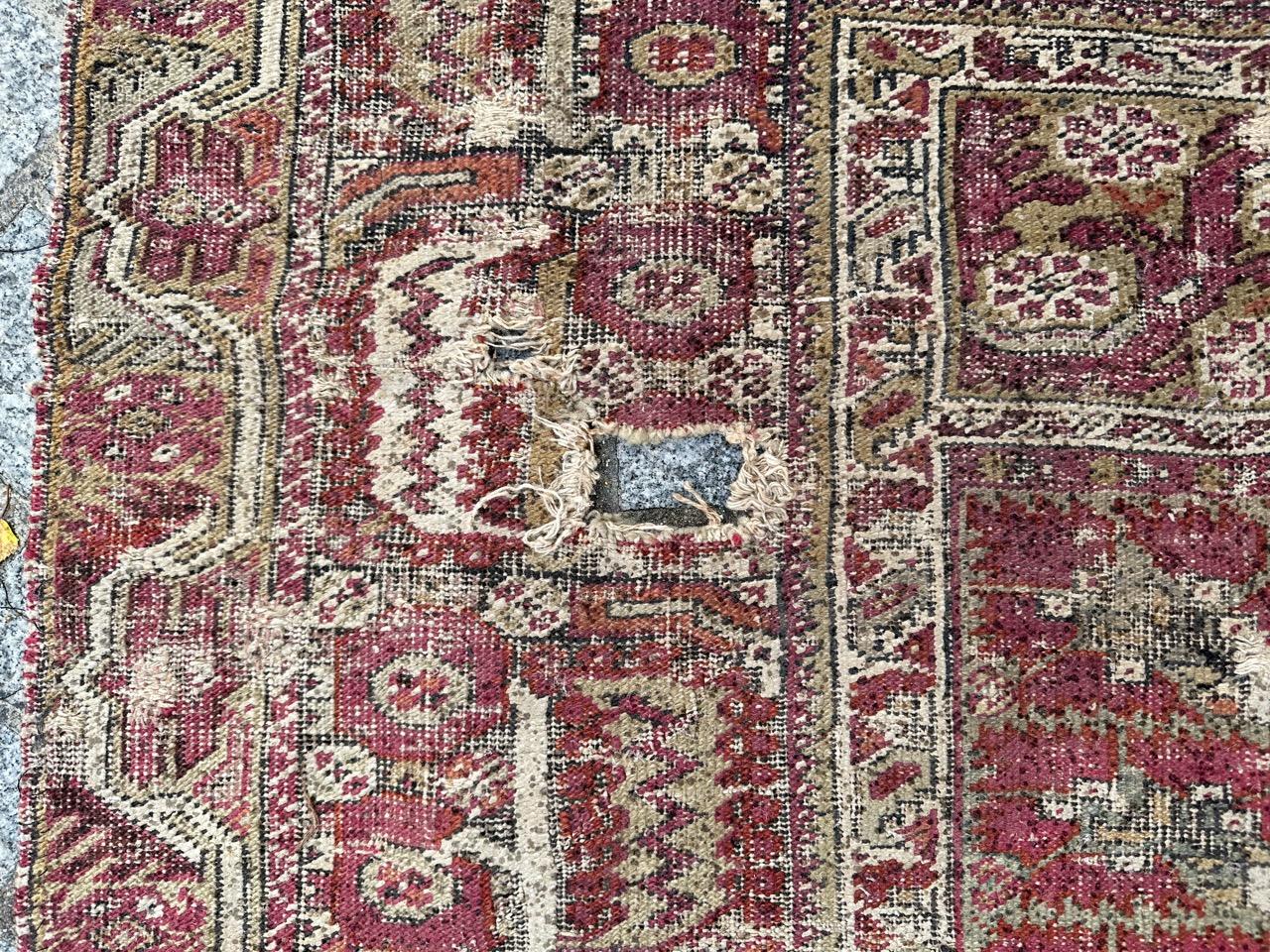 Wool Bobyrug’s Pretty Antique 18th century distressed Turkish Ghyordes rug For Sale