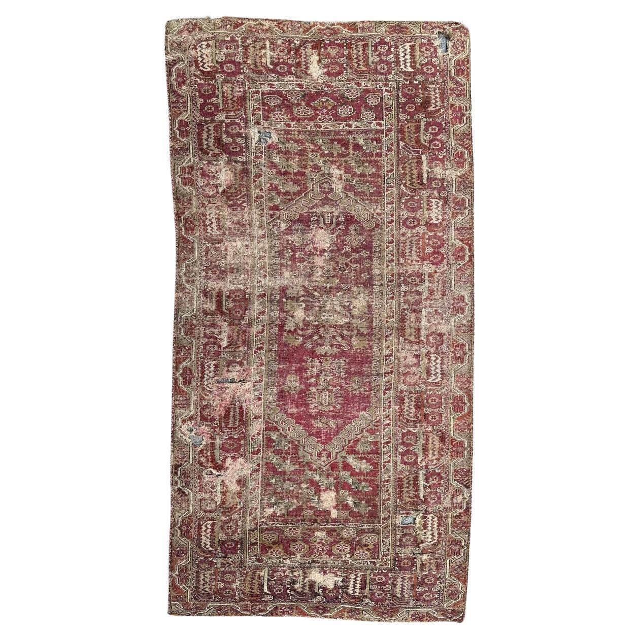 Bobyrug’s Pretty Antique 18th century distressed Turkish Ghyordes rug For Sale