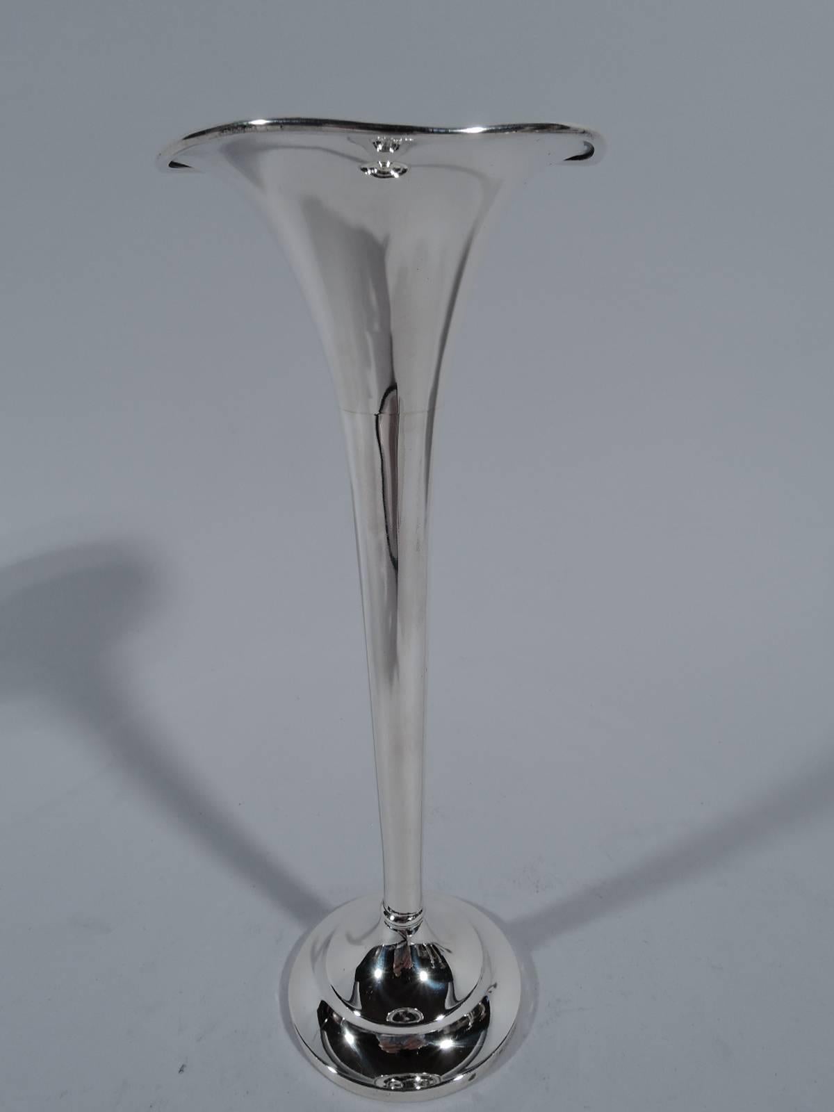 Pretty sterling silver bud vase. Made by Fradley in New York. Tapering and narrow with gently wavy rim and stepped foot. Hallmark includes no. 2656. Weighted.