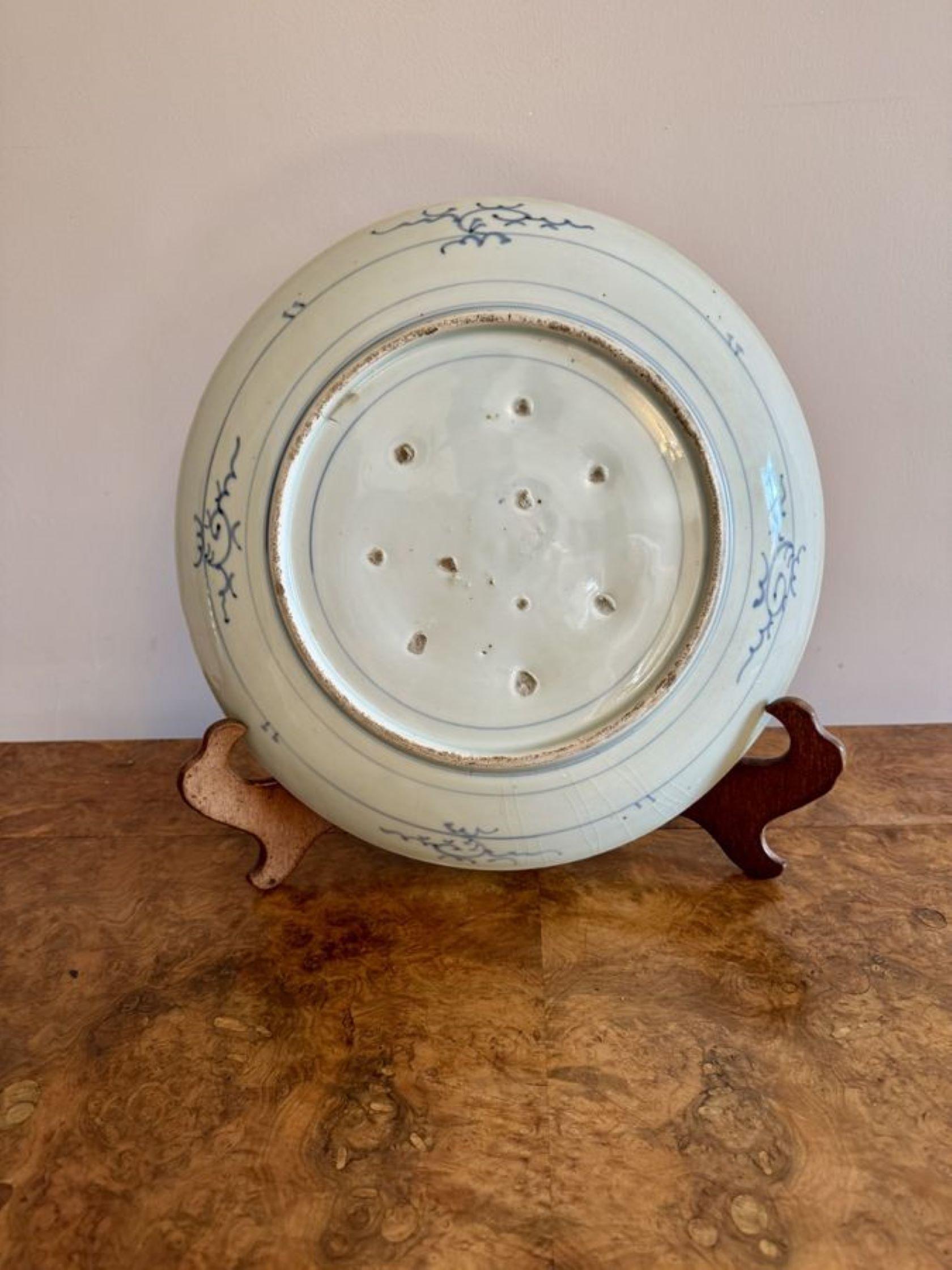Pretty antique blue and white large Japanese imari plate, having a pretty antique Japanese imari large plate hand painted decoration with blue flowers and leaves on a white ground.

D. 1900
