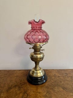 Pretty antique Edwardian brass oil lamp with cranberry glass shade