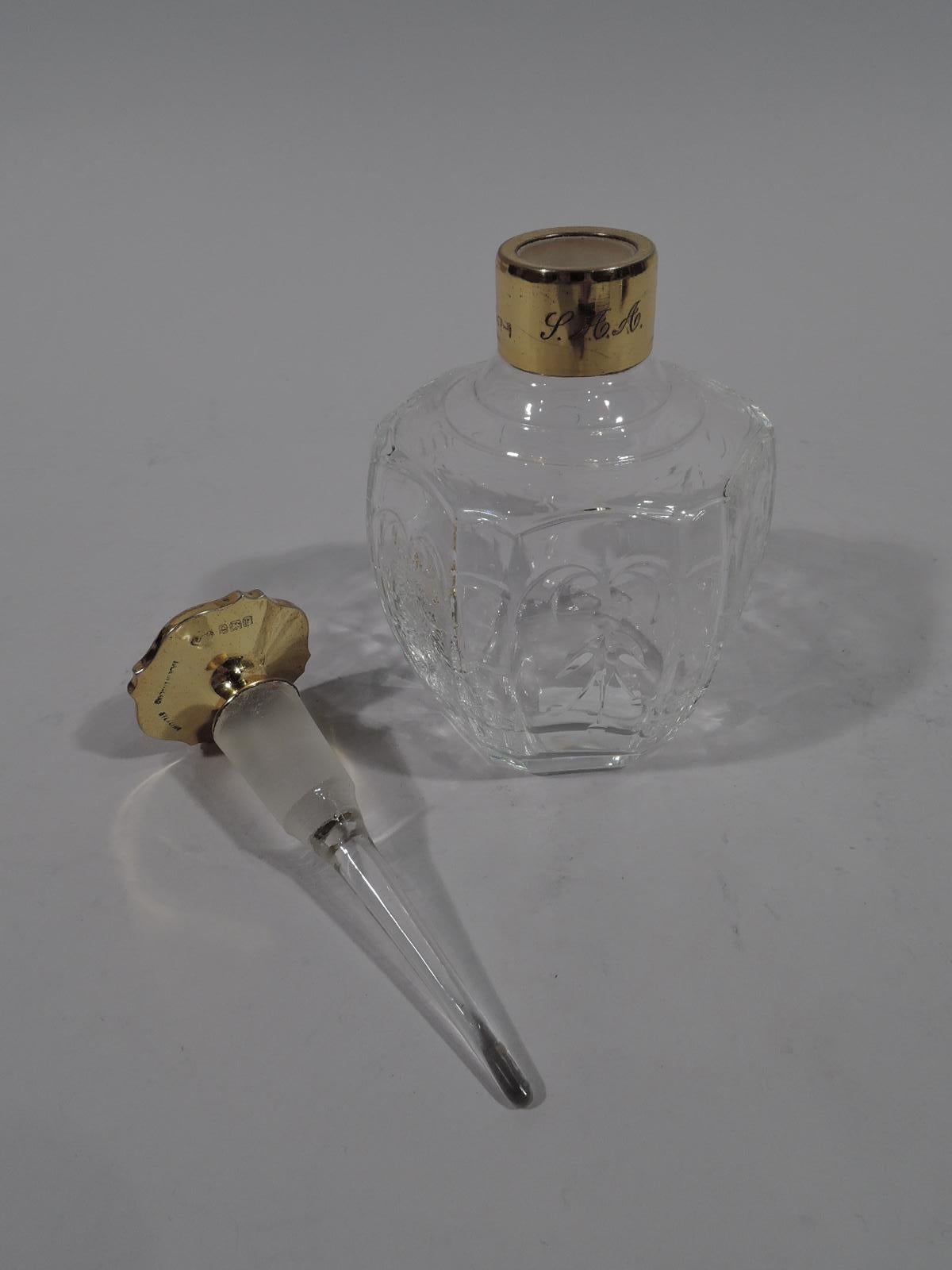 George V crystal perfume. Made by Adie Brothers in Birmingham in 1930. Curved and faceted sides with alternating pendant flowers and berry branch. Short neck in gilt sterling silver collar engraved with 3-letter monogram. Cover same and shaped with