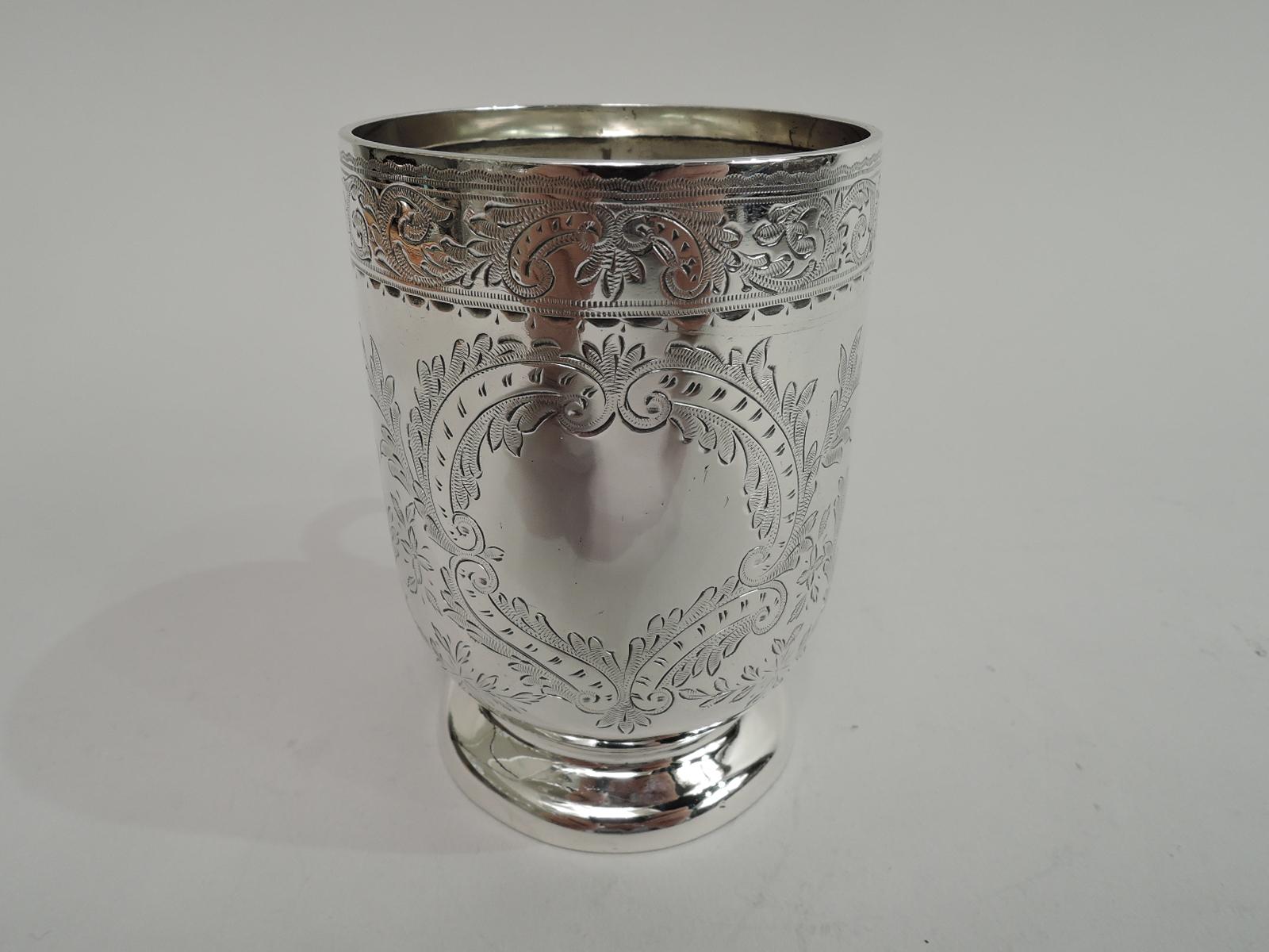 Pretty Victorian sterling silver baby cup. Made by John Thomas Heath & John Hartshorne Middleton in Birmingham in 1898. Tall bowl with curved bottom, c-scroll handle, and raised foot. Engraved leafing scrollwork and asymmetrical scrolled frame