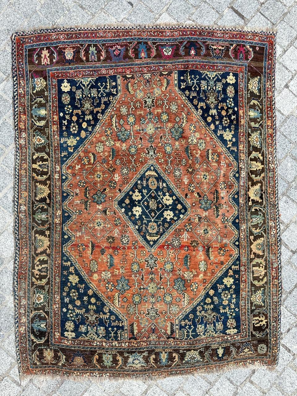 Introducing an exquisite Ghashghai rug that boasts a stunning geometrical tribal design and a captivating palette of natural colors. Meticulously hand-knotted with wool velvet on a wool foundation, this rug showcases intricate craftsmanship. The