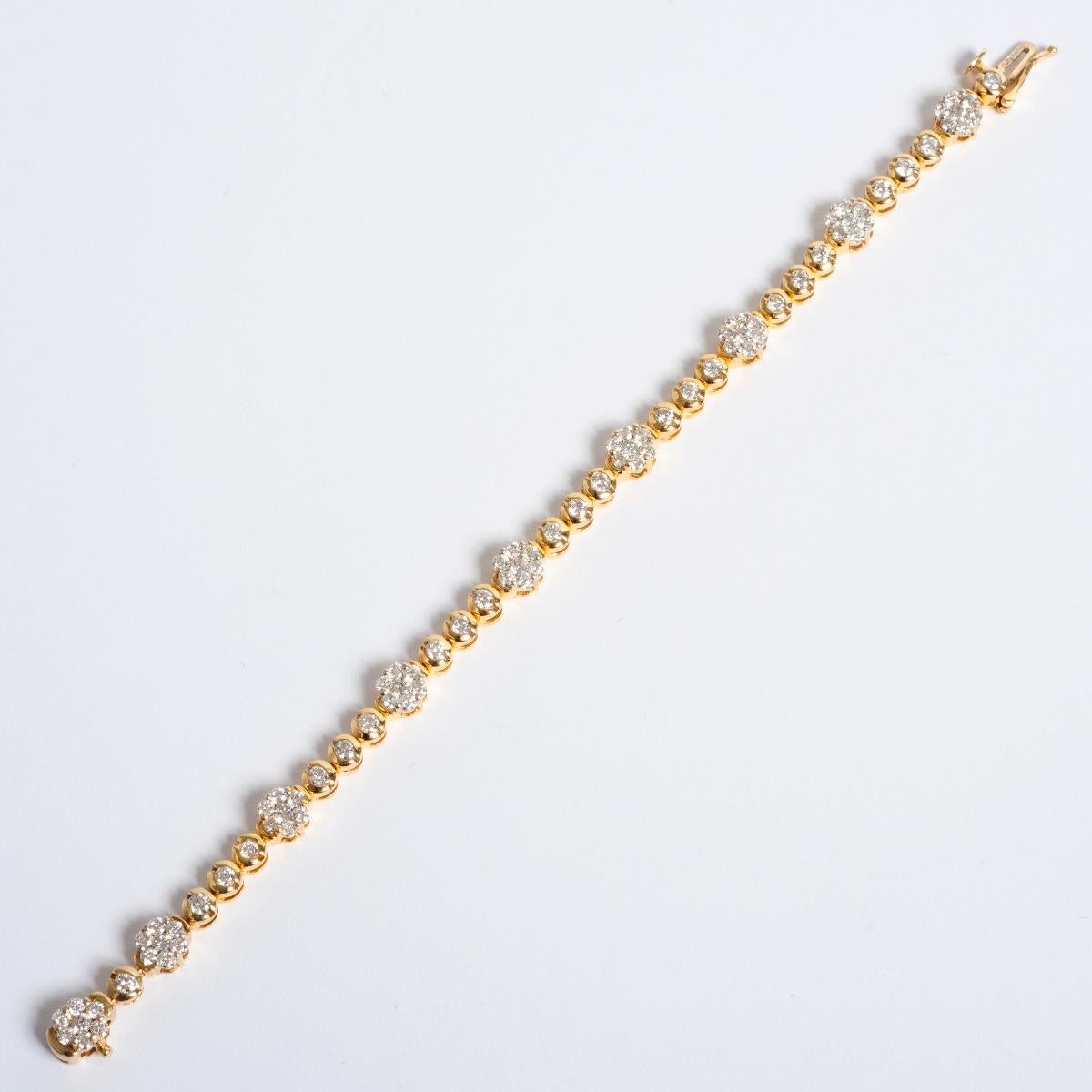 A unique piece within our carefully curated Vintage & Prestige fine jewellery collection, we are delighted to present the following: This pretty Diamond Daisy Bracelet is set in 14K Yellow Gold wit 3.75ct in diamonds. The bracelet measures 160mm. A
