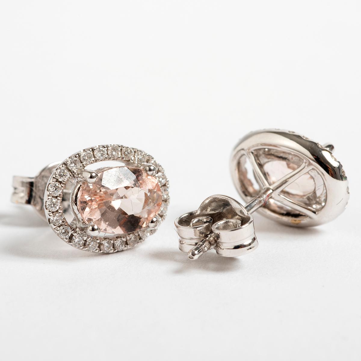 A unique piece within our carefully curated Vintage & Prestige fine jewellery collection, we are delighted to present the following: These pretty diamond and morganite earrings are set in 18 carat white gold. Measuring 8mm x 10mm.