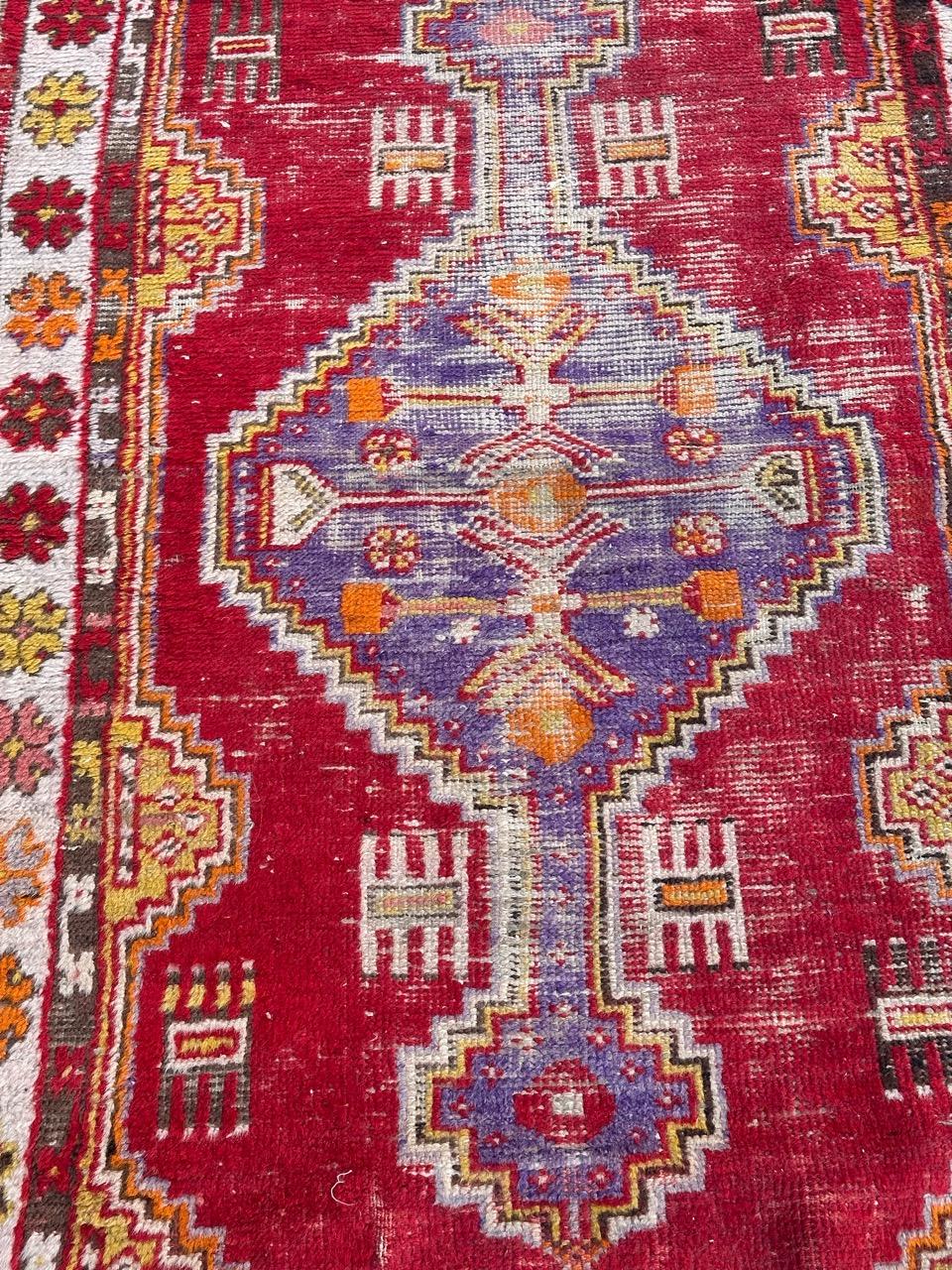 Pretty early 20th century Turkish rug entirely hand knotted with wool velvet on cotton foundation.
Introducing our exquisite Turkish carpet from the early 20th century, imbued with history and allure. Its authentic signs of wear tell tales of years